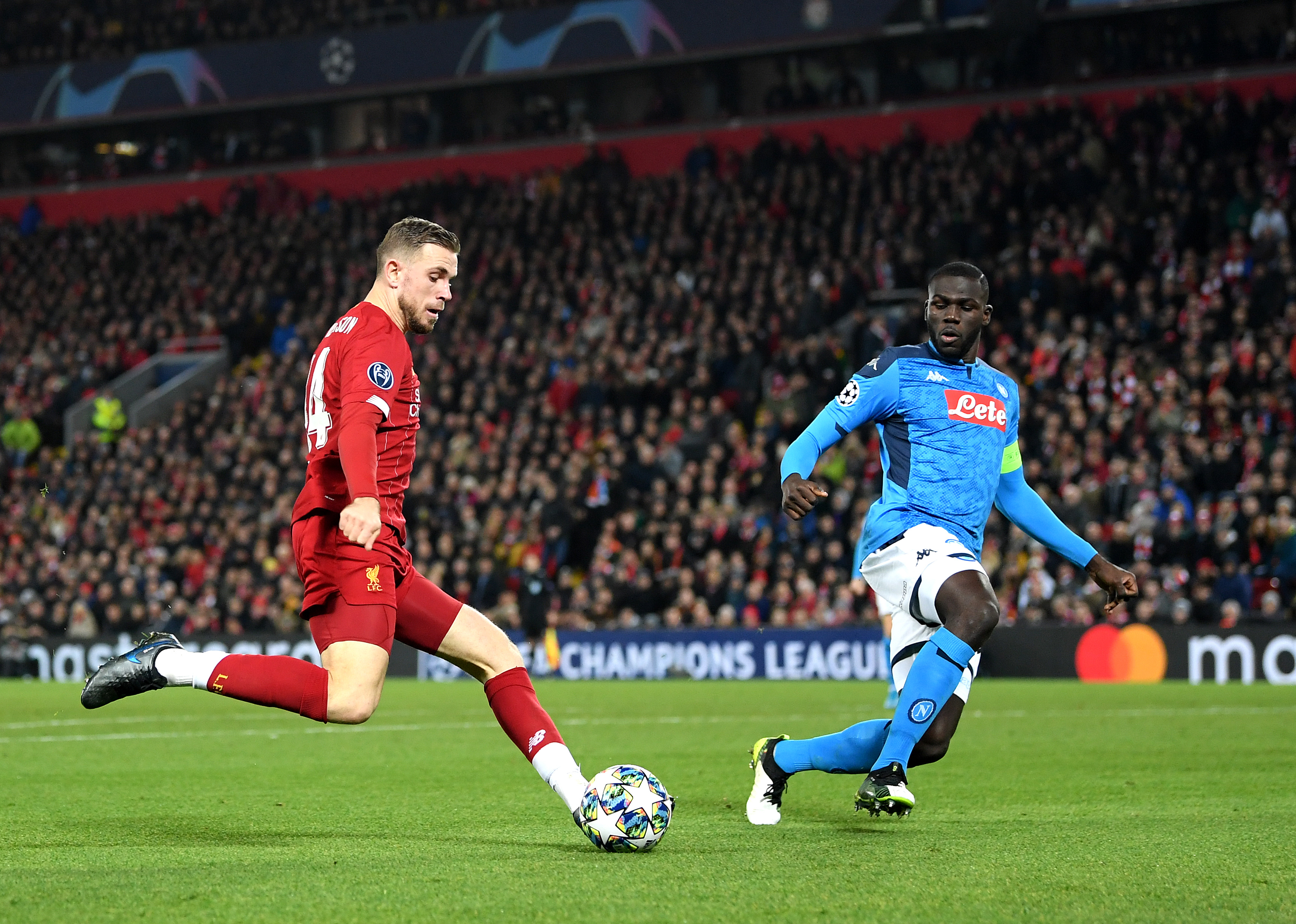 Jordan Henderson of Liverpool is put under pressure by Napoli's Kalidou Koulibaly.