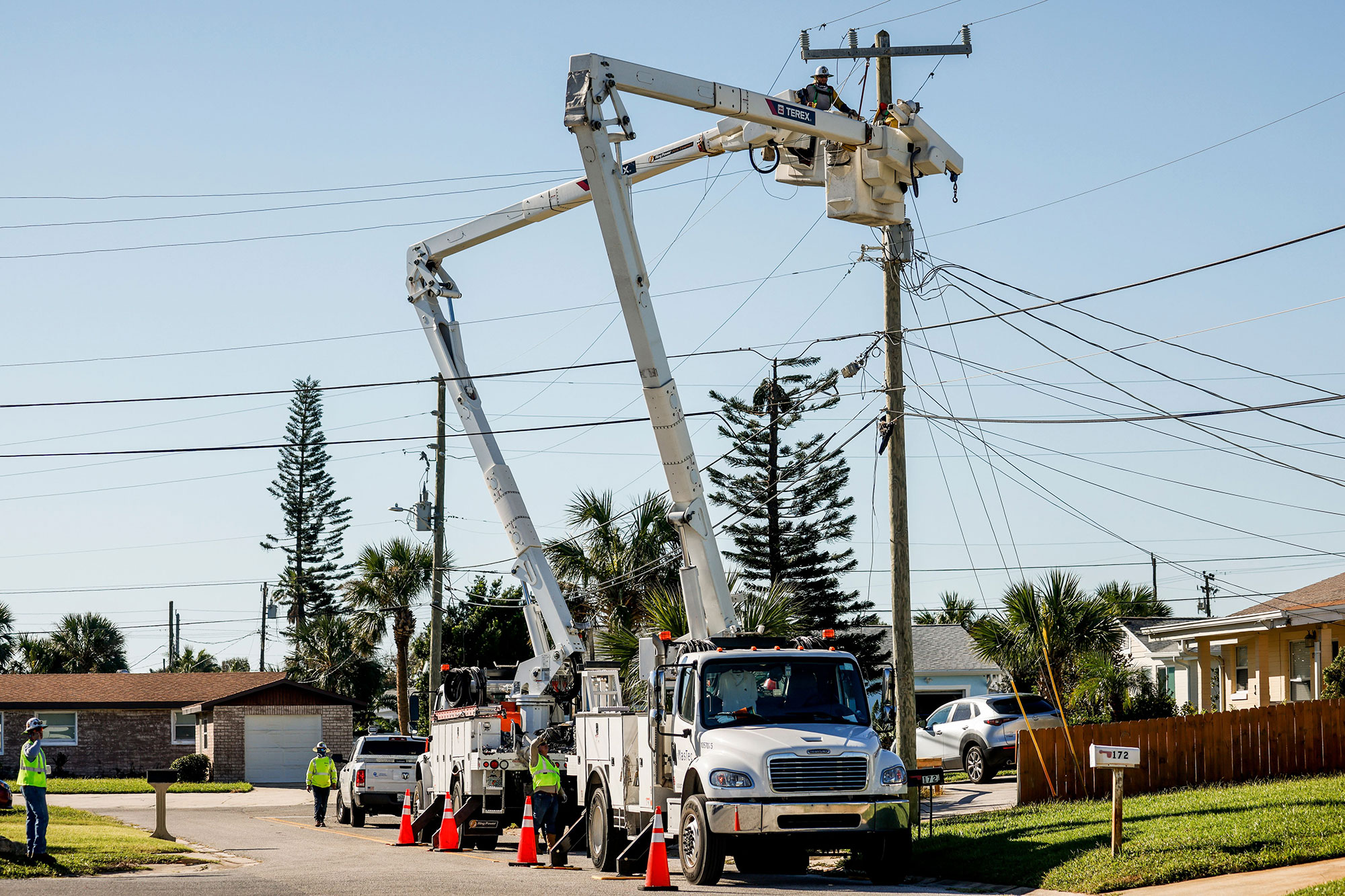 Linemen work to restore power in Daytona Beach Shores, Florida, on October 2. 