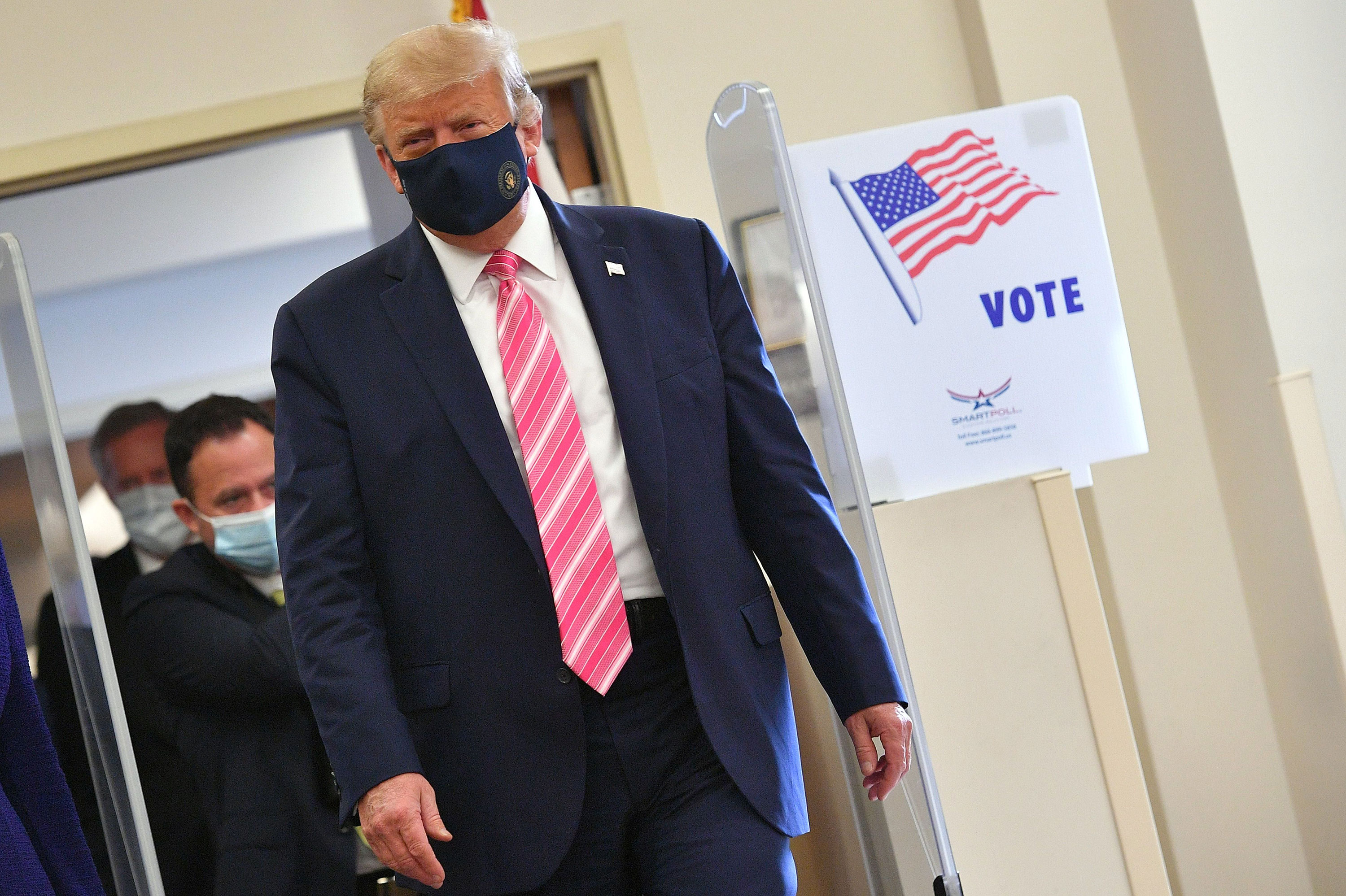 President Donald Trump leaves after casting his ballot at the Palm Beach County Public Library in West Palm Beach, Florida, on October 24.