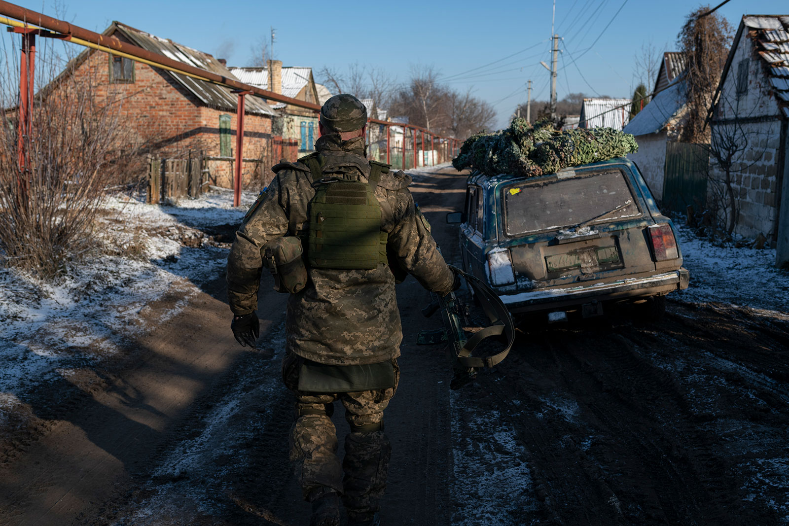 A Ukrainian military member walks a street in Krasna Hora, Ukraine, on January 7. 
