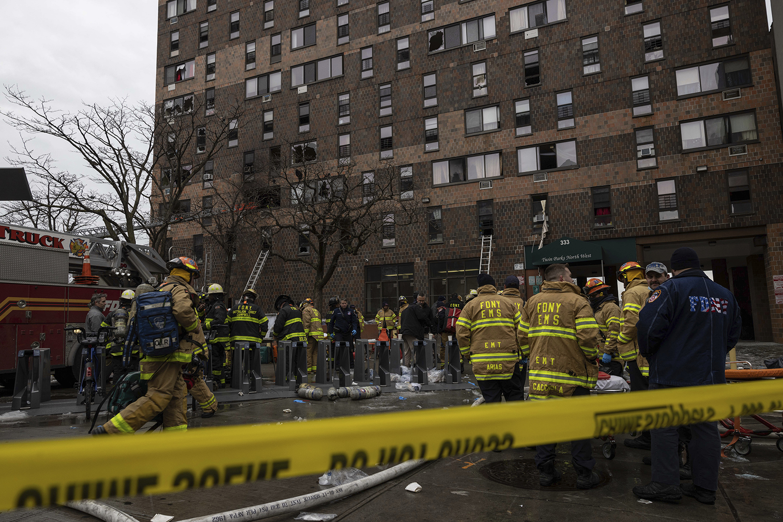 Emergency personnel work at the scene of a fatal fire at an apartment building in the Bronx on Sunday. 