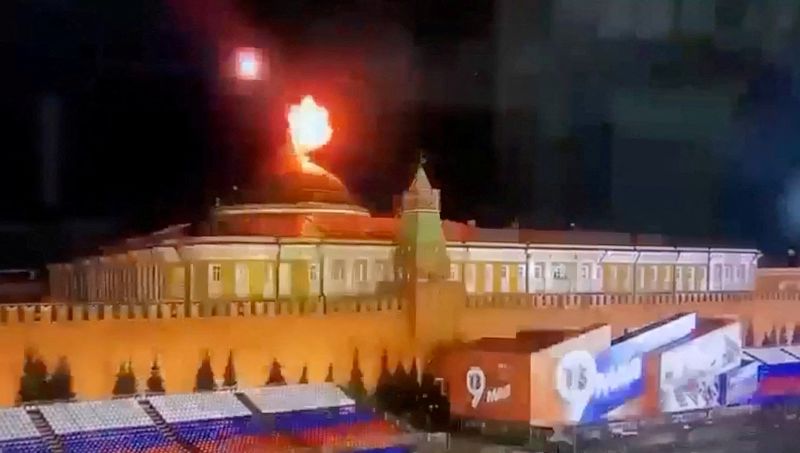 A still image taken from video shows a flying object exploding in an intense burst of light near the dome of the Kremlin Senate building during the alleged Ukrainian drone attack in Moscow, Russia, in this image taken from video obtained by Reuters on May 3. 