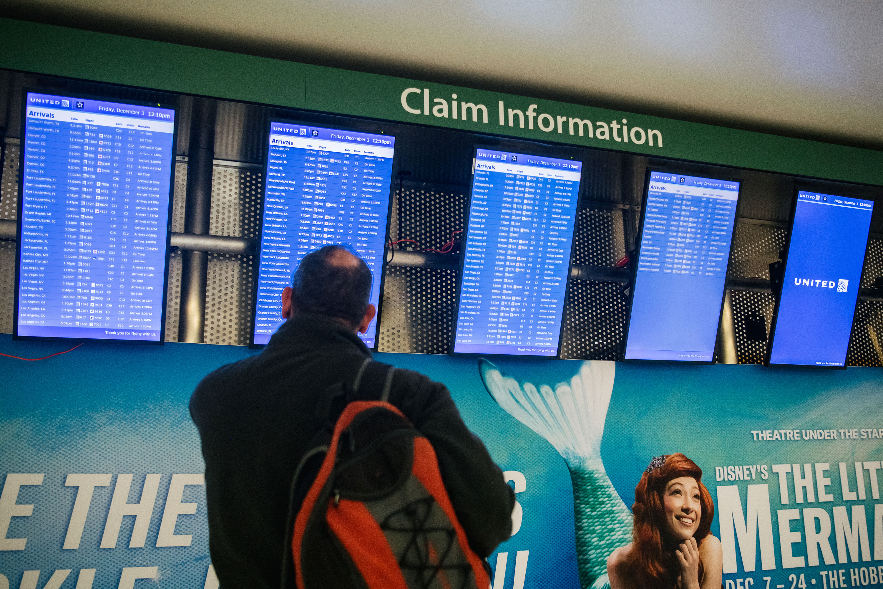 A traveller checks arrivals and departures information at George Bush Intercontinental Airport in Houston on December 3.