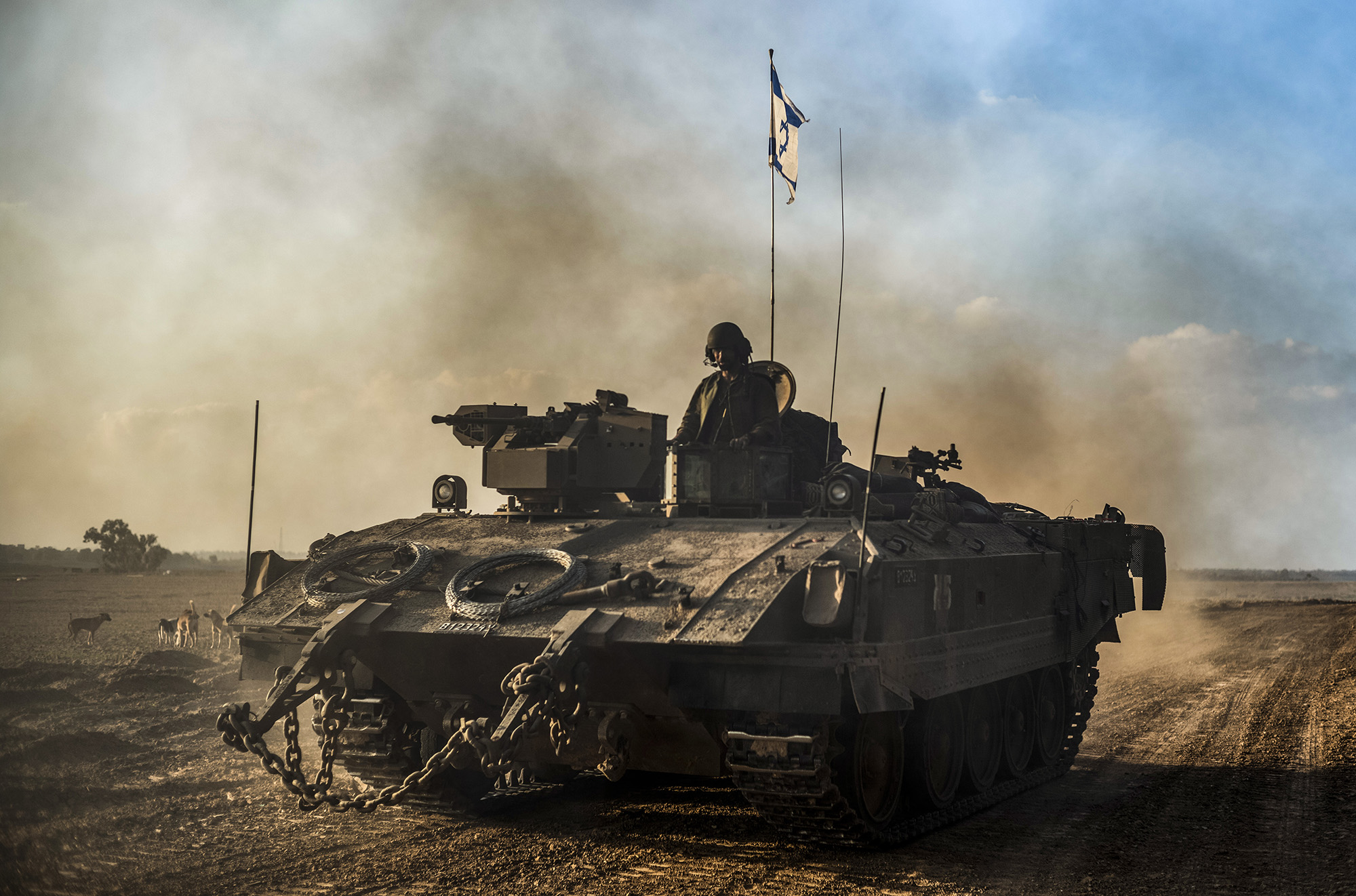 An Israeli tank moves near the Israel-Gaza border in Beeri, Israel, on December 1. 