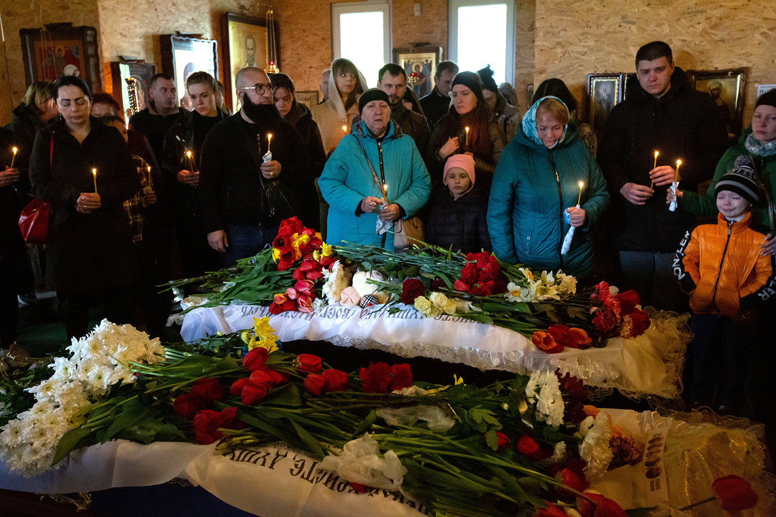 People attend the funeral of two children who died as a result of a Russian missile strike in Uman, Ukraine, on April 30. 