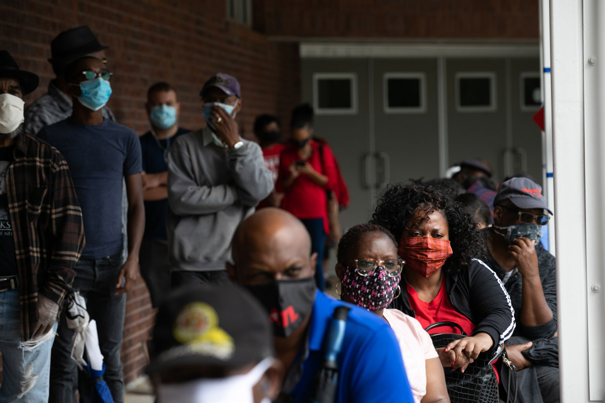 People wait in line on the first day of early voting for the general election at the C.T. Martin Natatorium and Recreation Center in Atlanta, Georgia on October 12.