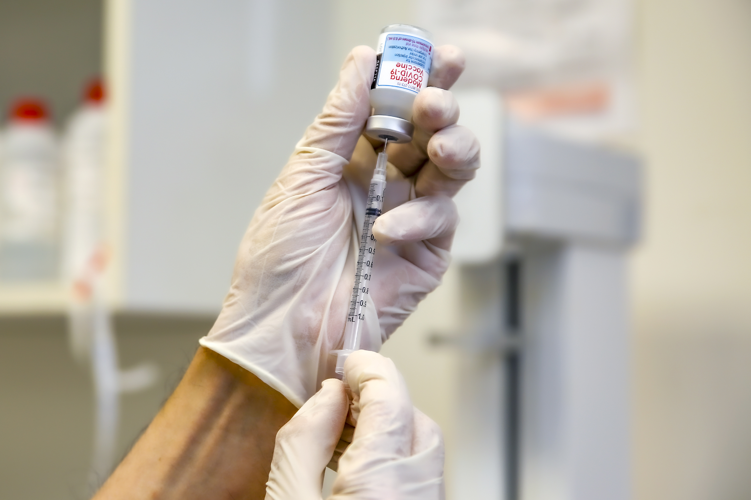 Michael Stremfel, owner of the pharmacy, prepares a booster shot of Moderna vaccine for Covid19 at Flintridge Pharmacy on Tuesday, November 16, 2021 in La Cañada Flintridge, CA. 