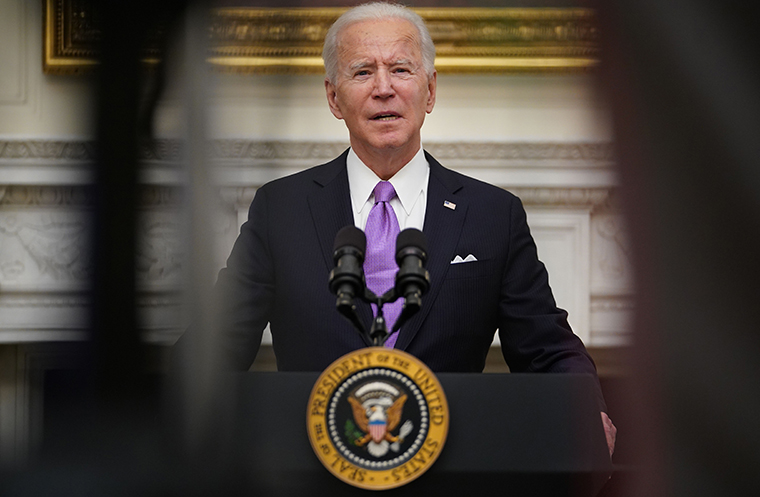 US President Joe Biden speaks about the Covid-19 response before signing executive orders in the State Dining Room of the White House in Washington, DC, on January 21, 2021. 