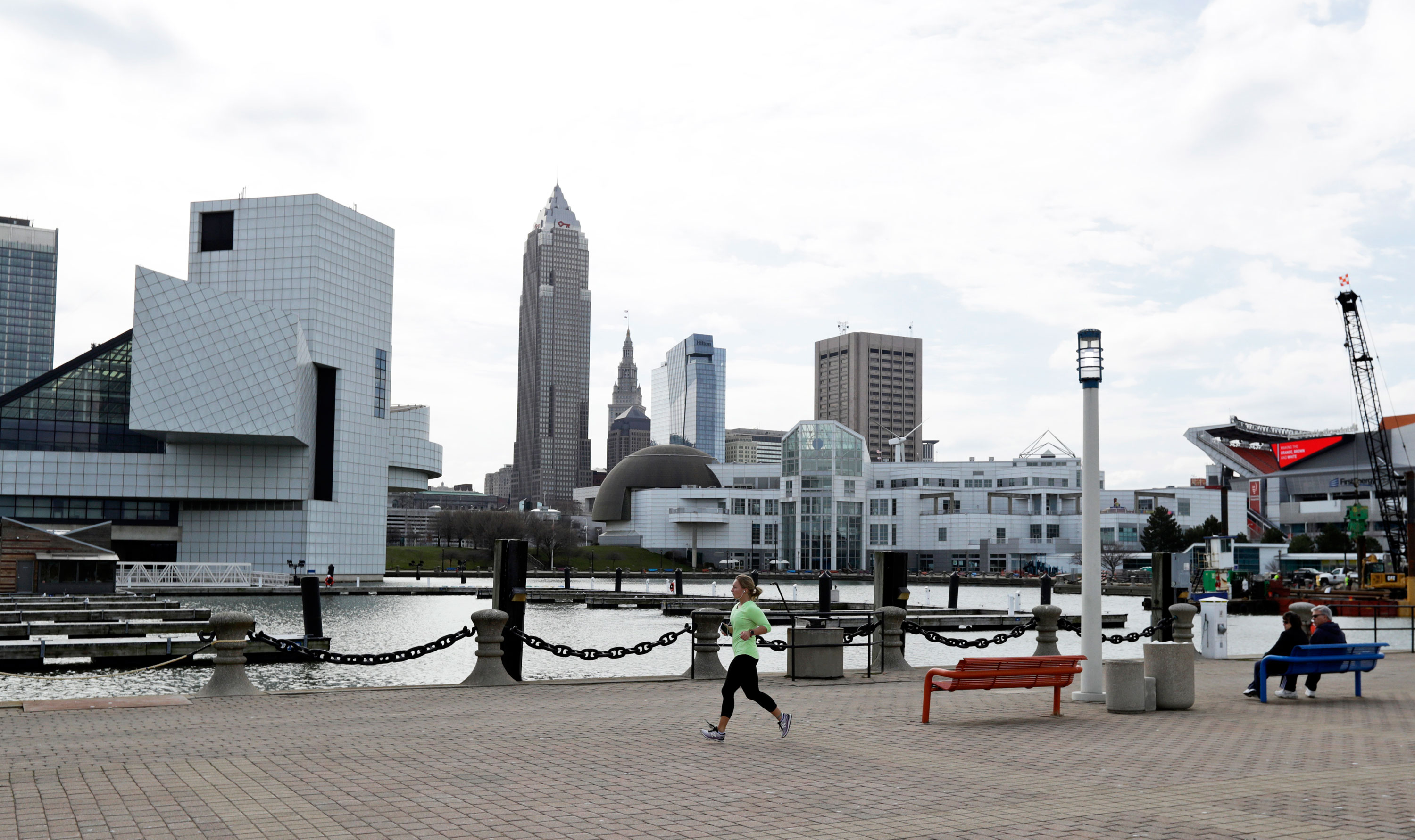 A woman jogs along the shores of Lake Erie in downtown Cleveland on March 26.