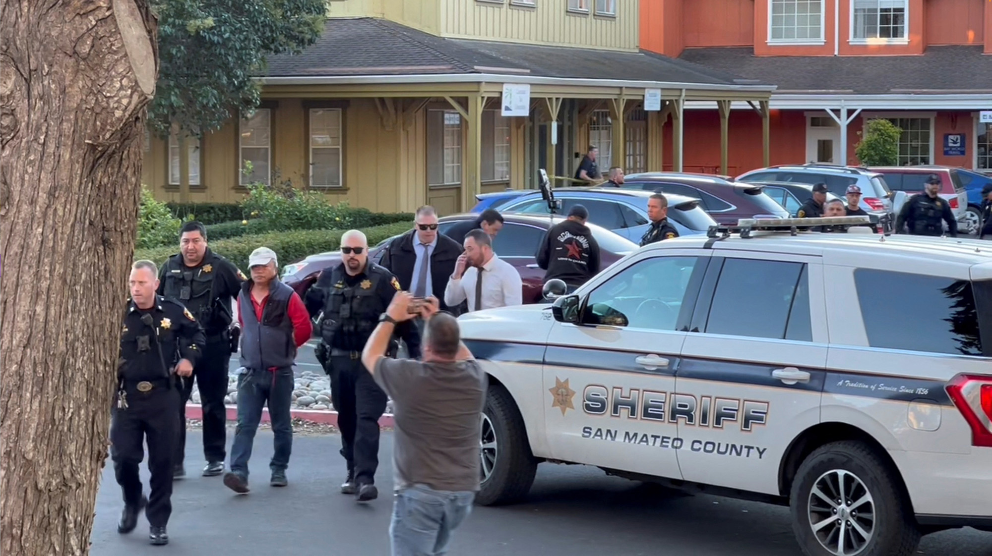 Police officers detain a man, believed by law enforcement to be the Half Moon Bay mass shooting suspect, in Half Moon Bay, California, U.S., on January 23, in this screengrab taken from a social media video. 