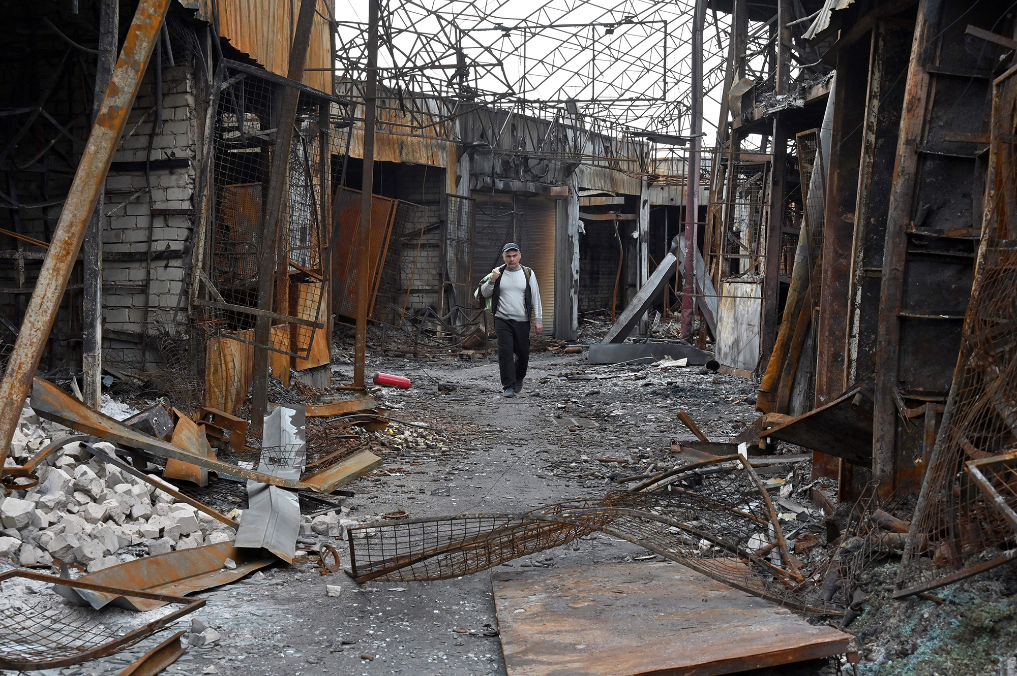 A man walks in a destroyed market in Kharkiv, Ukraine on May 21. 