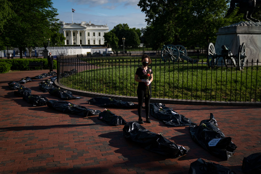 Demonstrators display body bags in protest near the White House on Wednesday in Washington.