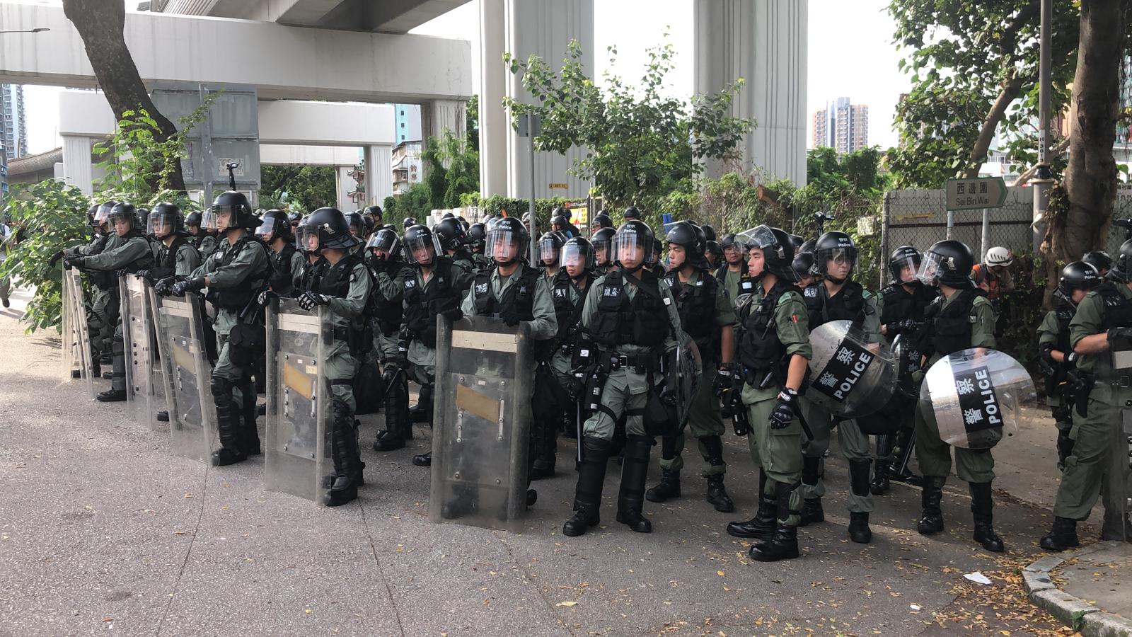Police gather at Yuen Long after thousands protest against violence used against peaceful protesters.