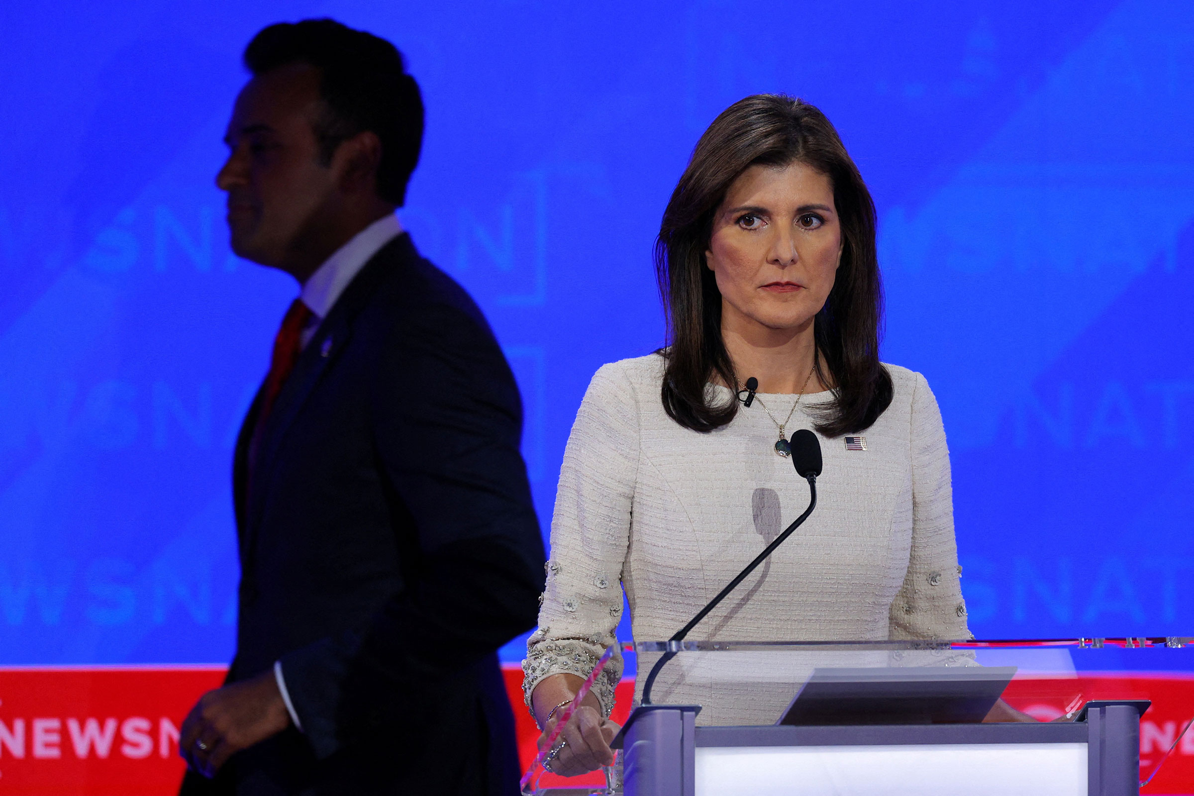 Nikki Haley looks on as Vivek Ramaswamy passes by during a break at the fourth Republican candidates' presidential debate at the University of Alabama in Tuscaloosa, Alabama, on December 6.