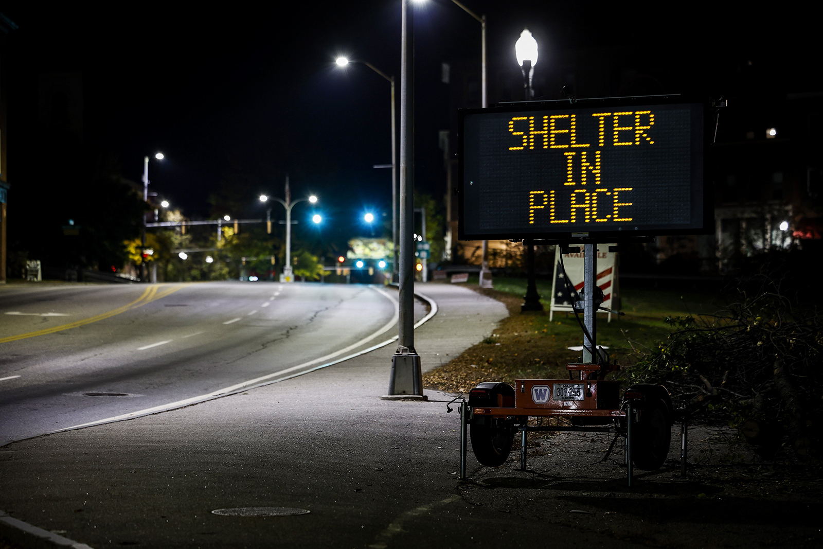 A road sign reads 'Shelter in Place' after a man reportedly opened fire killing and injuring numerous people in downtown Lewiston, Maine, on October 25.