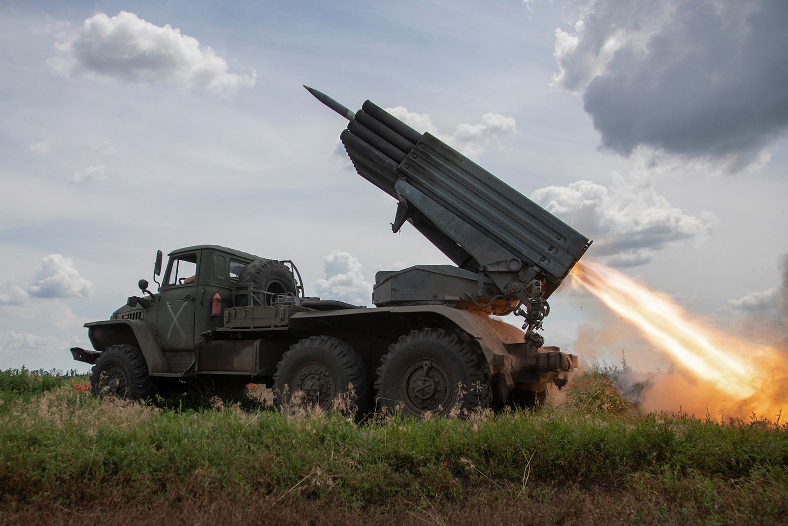 Ukrainian servicemen fire a BM-21 Grad multiple launch rocket system towards Russian troops near a front line in Donetsk region, Ukraine on June 21.