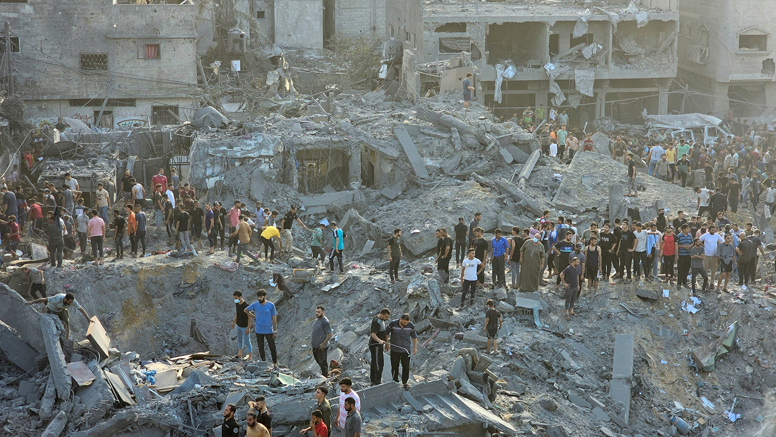 Palestinians search for casualties at the site of a strike in Jabalya refugee camp in Gaza on Tuesday.