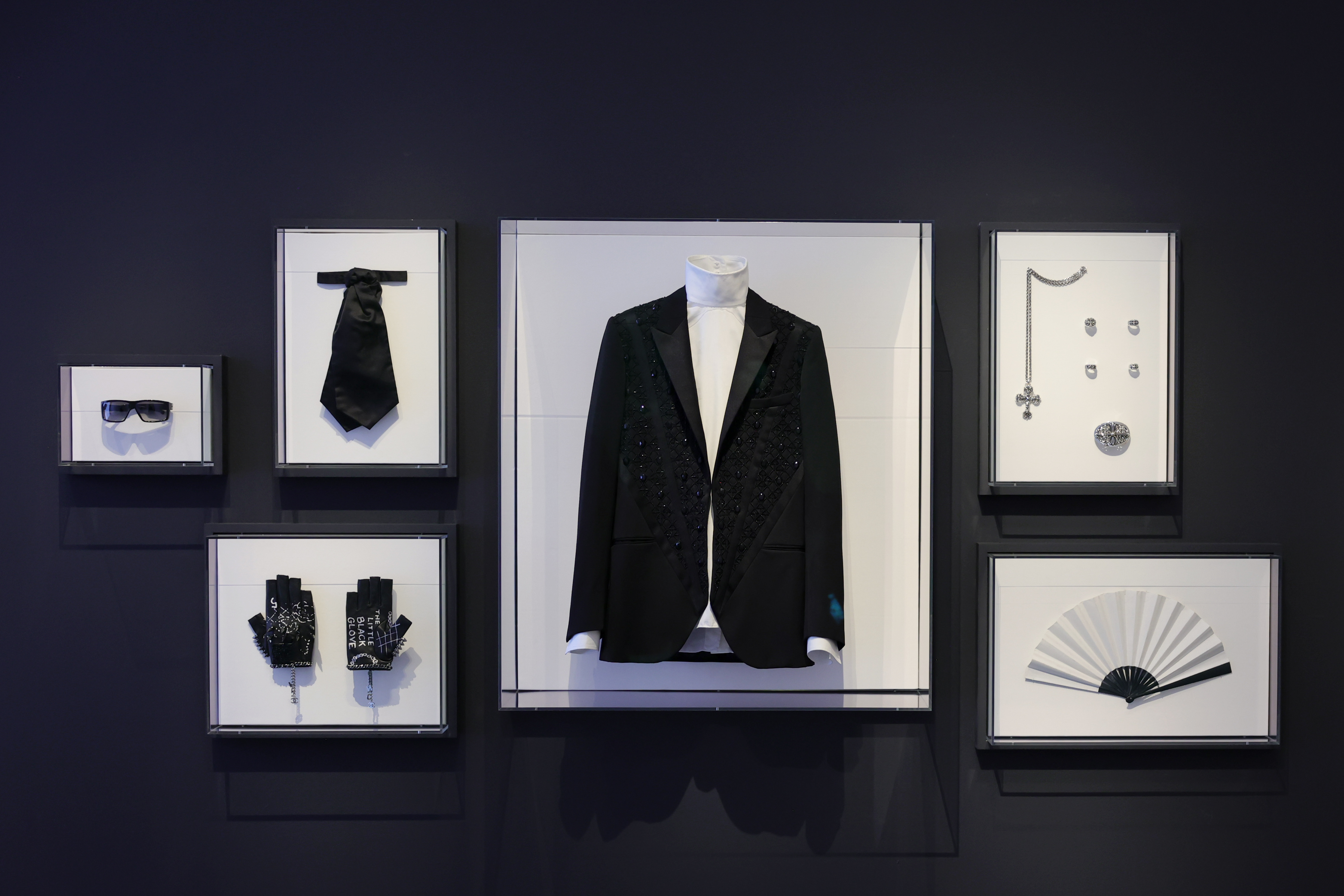 Dark sunglasses, leather gloves, a pleated fan: Key parts of Karl Lagerfeld's personal aesthetic — which the designer curated as carefully as his collections — are displayed during the 2023 press preview of the Costume Institute's exhibition, "Karl Lagerfeld: A Line of Beauty," on May 1, 2023.