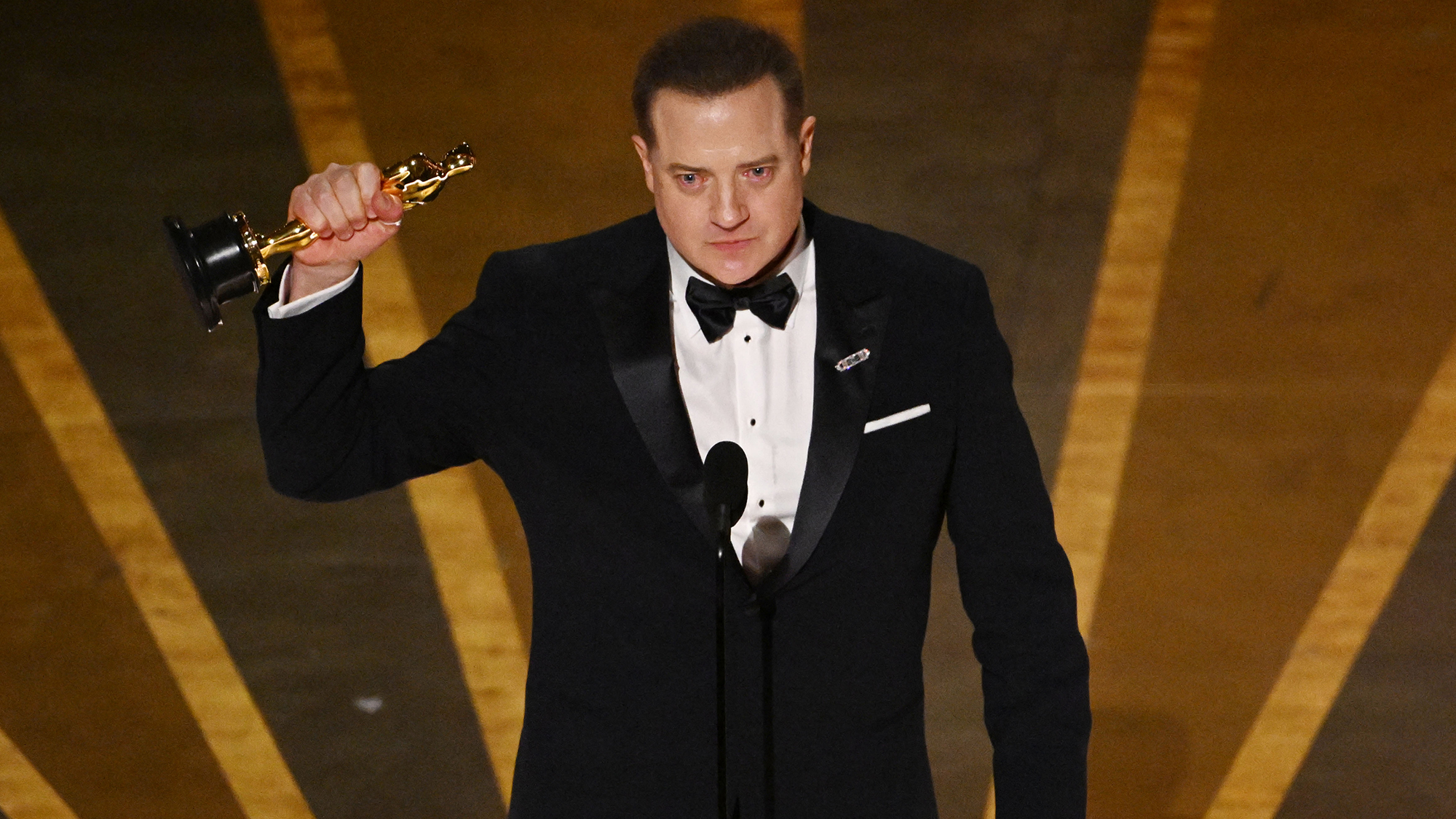 Brendan Fraser accepts the best actor award for “The Whale.” 