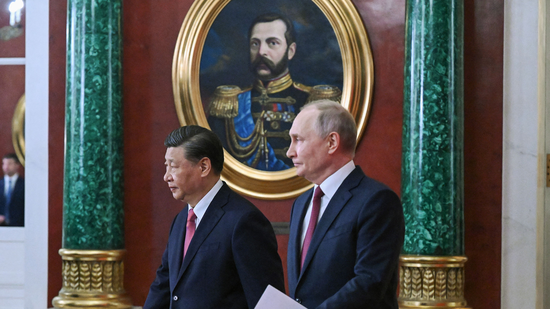 Russian President Vladimir Putin and China's President Xi Jinping arrive for a signing ceremony following their talks at the Kremlin in Moscow on March 21.