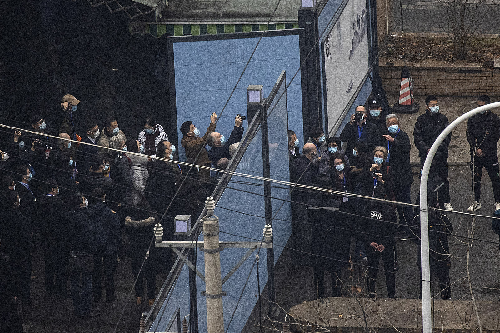 Members of the World Health Organization investigative team visit Huanan seafood market in Wuhan, China, on January 31. 