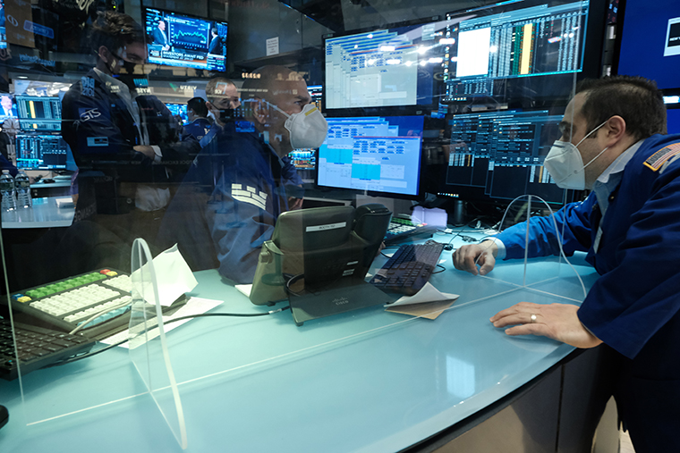  Traders work on the floor of the New York Stock Exchange on January 26 in New York City. 