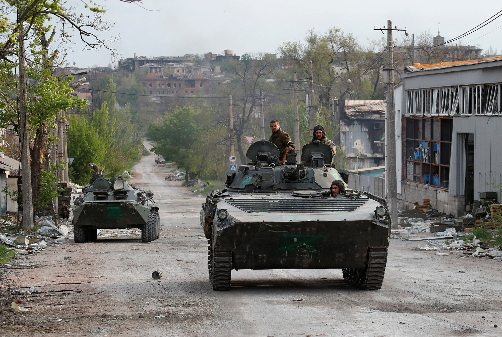 Service members of pro-Russian troops ride an infantry combat vehicle near the Azovstal steel plant in the southern port city of Mariupol, Ukraine, on May 5.