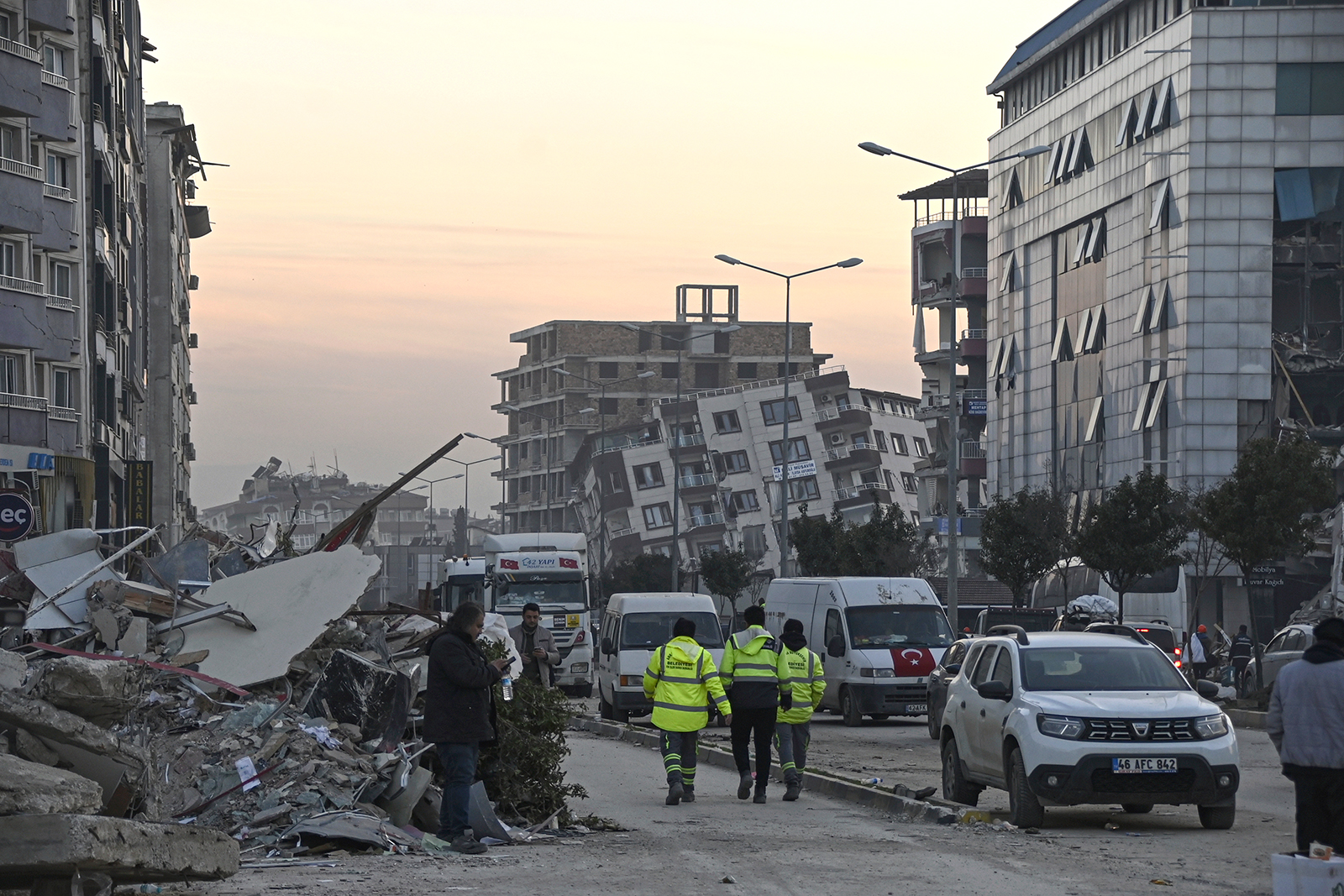 People walk through the destroyed center of Antakya, Turkey on February 9.