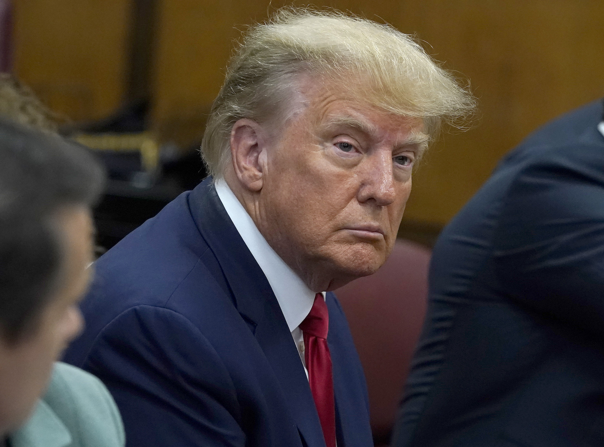 Former President Donald Trump sits with his attorneys inside the courtroom during his arraignment at the Manhattan Criminal Court on Tuesday.