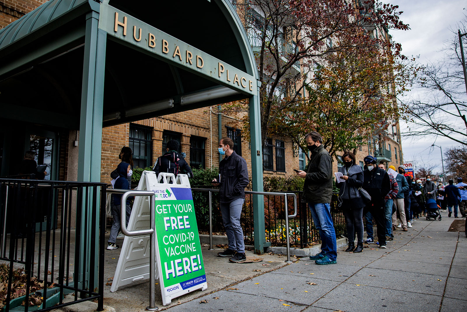 People line up outside a Covid-19 vaccination site in Washington, DC, on December 3.