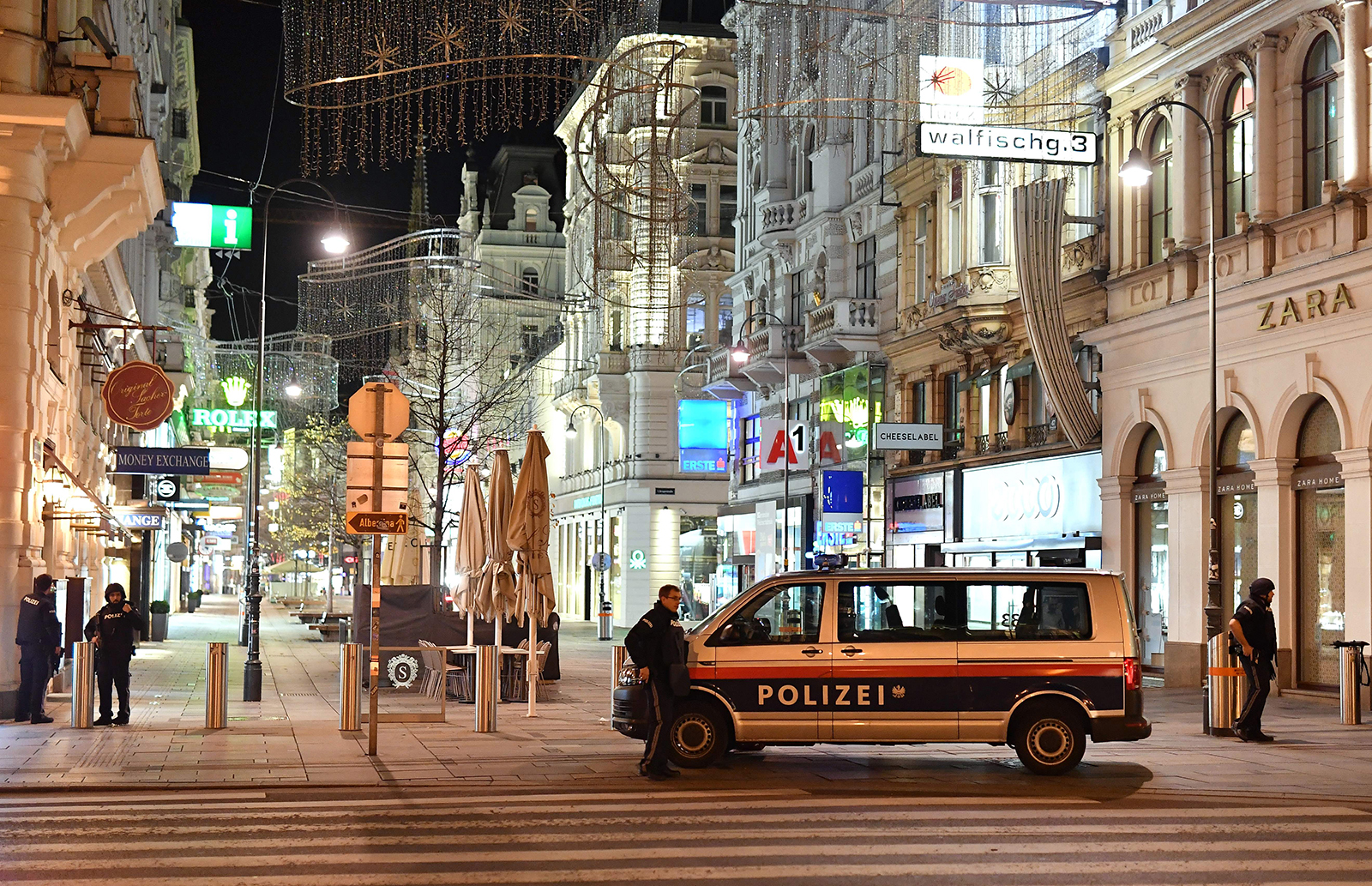 Armed policemen stand guard in a shopping street in the center of Vienna on November 2.