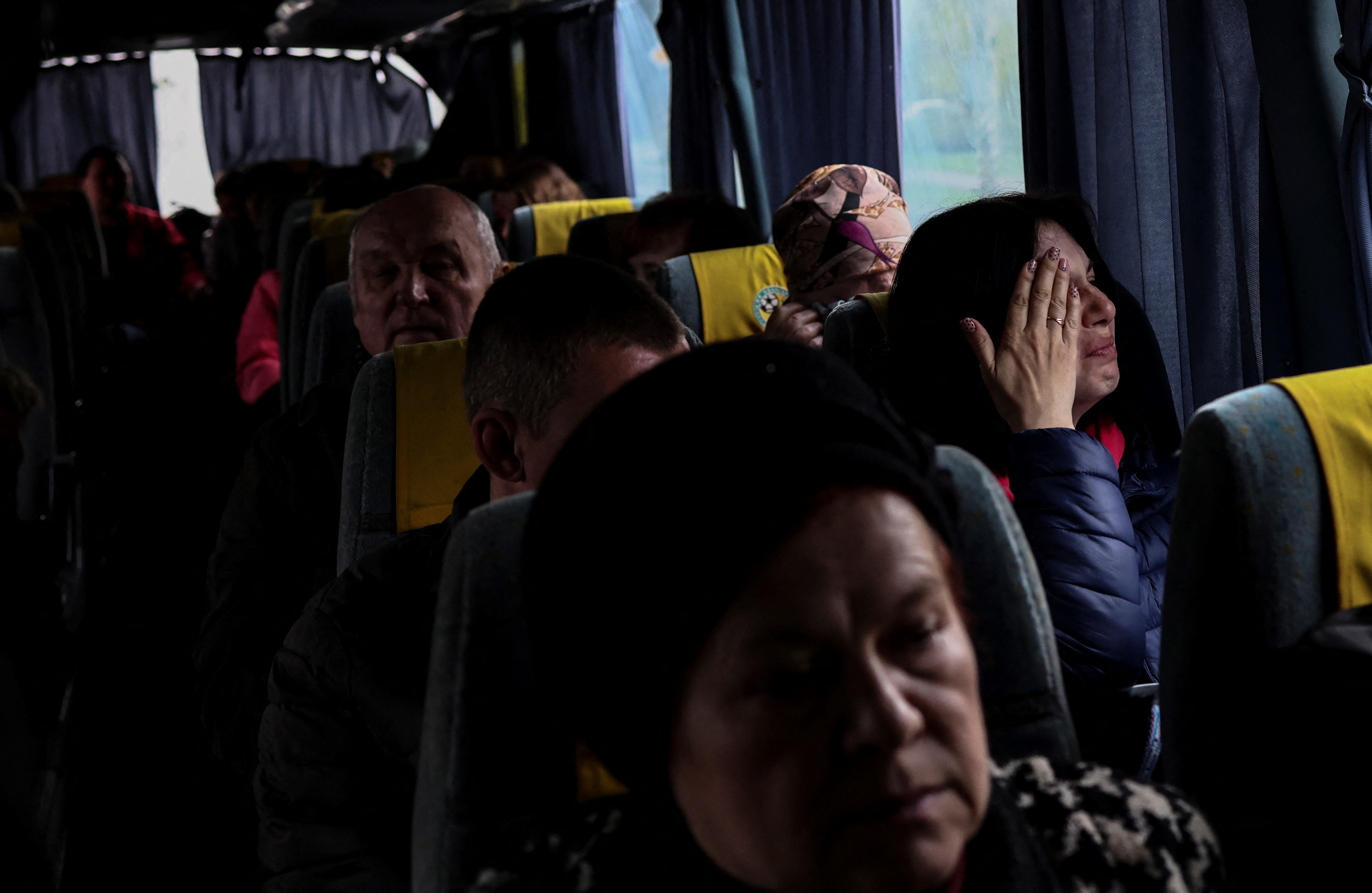 A woman cries as the bus leaves the Slovyansk central station, in the Donbas region on April 12.  