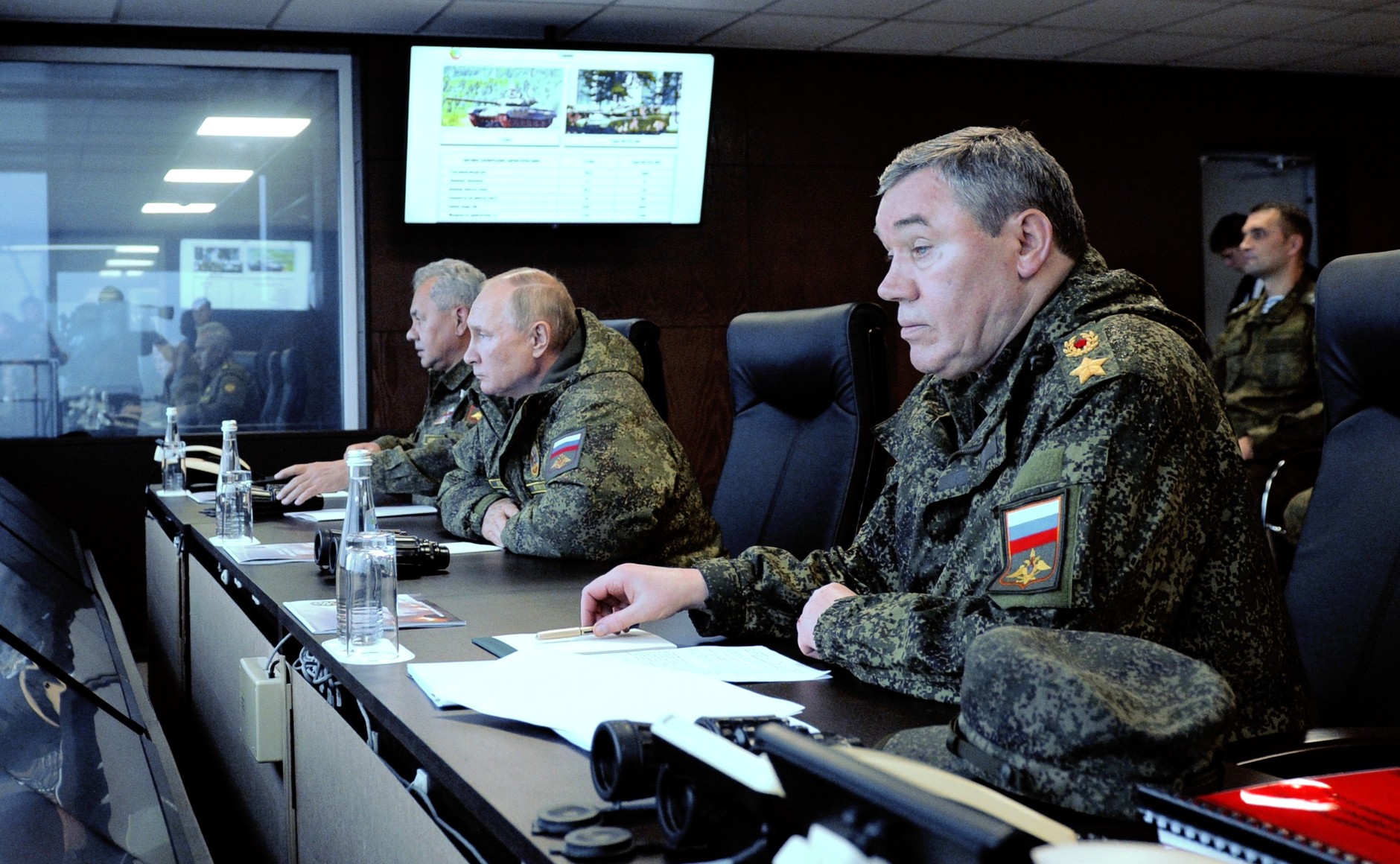Vladimir Putin, center, together with Defence Minister Sergei Shoigu, left, and Chief of the General Staff of the Russian Armed Forces and First Deputy Defence Minister Valery Gerasimov, right, observe the main stage of the Vostok-2022 strategic command post exercise at the Sergeyevsky range in the Primorye Territory on September 6.