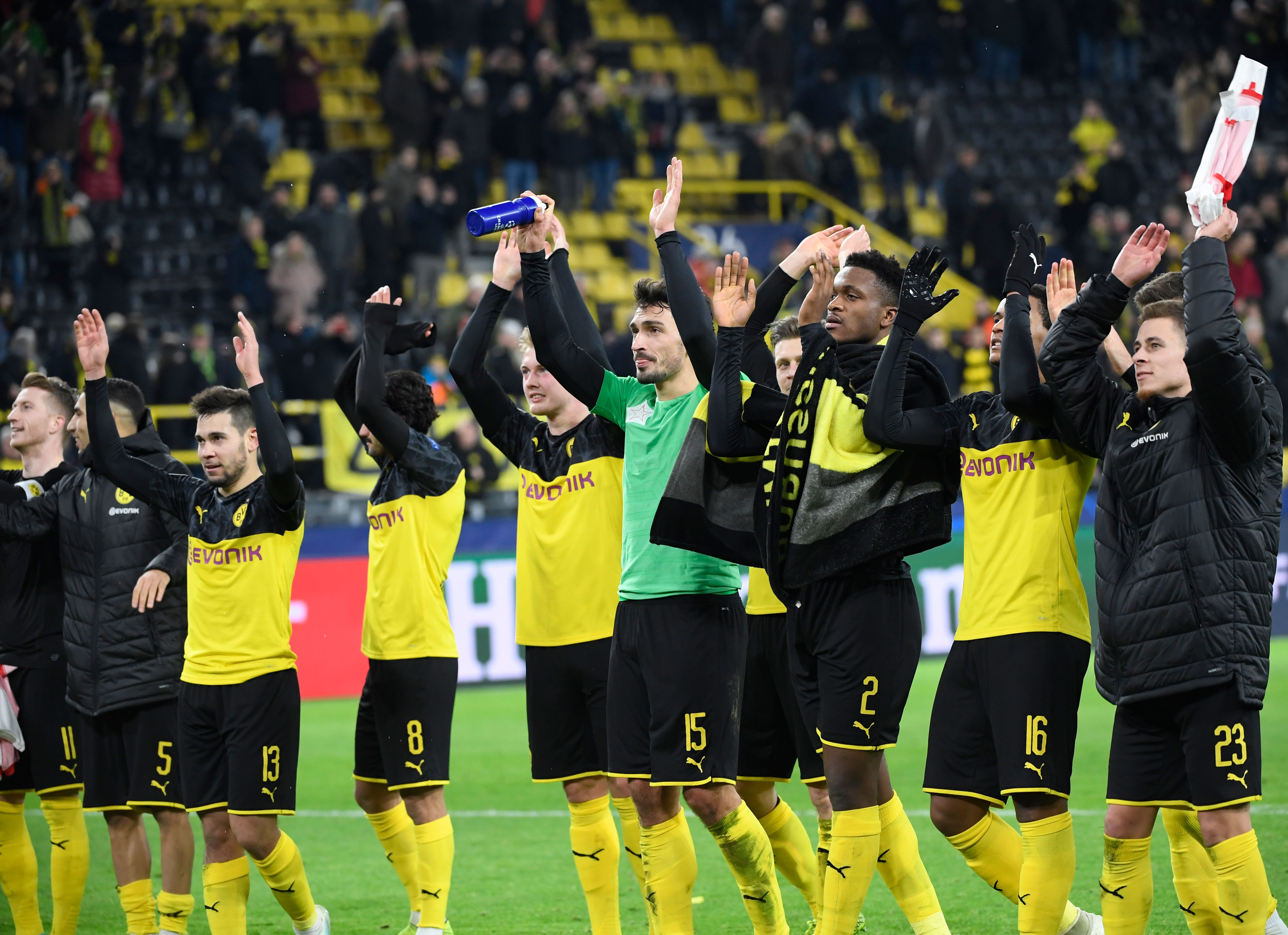 Dortmund's players celebrate after clinching qualification for the last 16