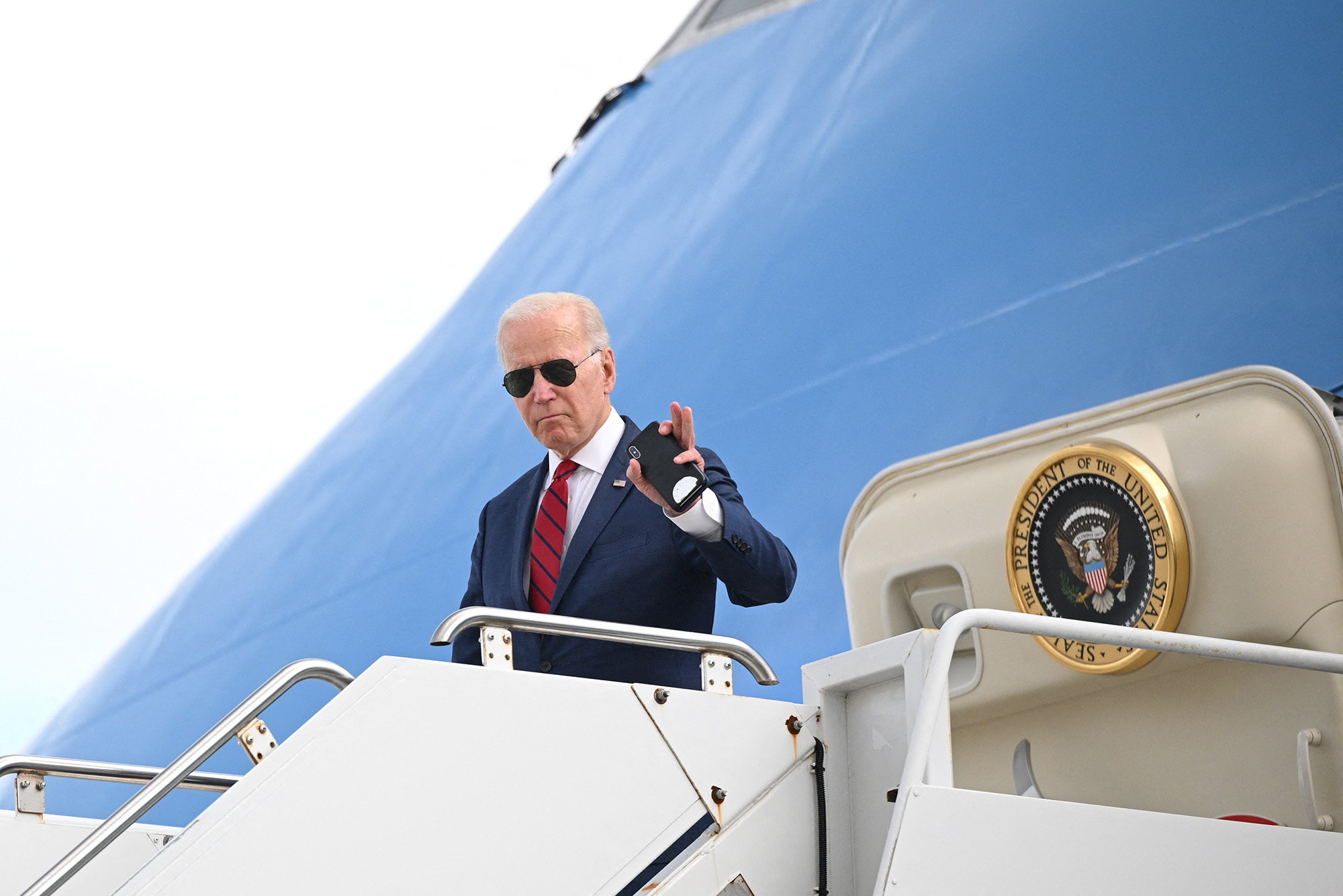 US President Joe Biden waves as he disembarks Air Force One at John F Kennedy International Airport in New York City on September 20.