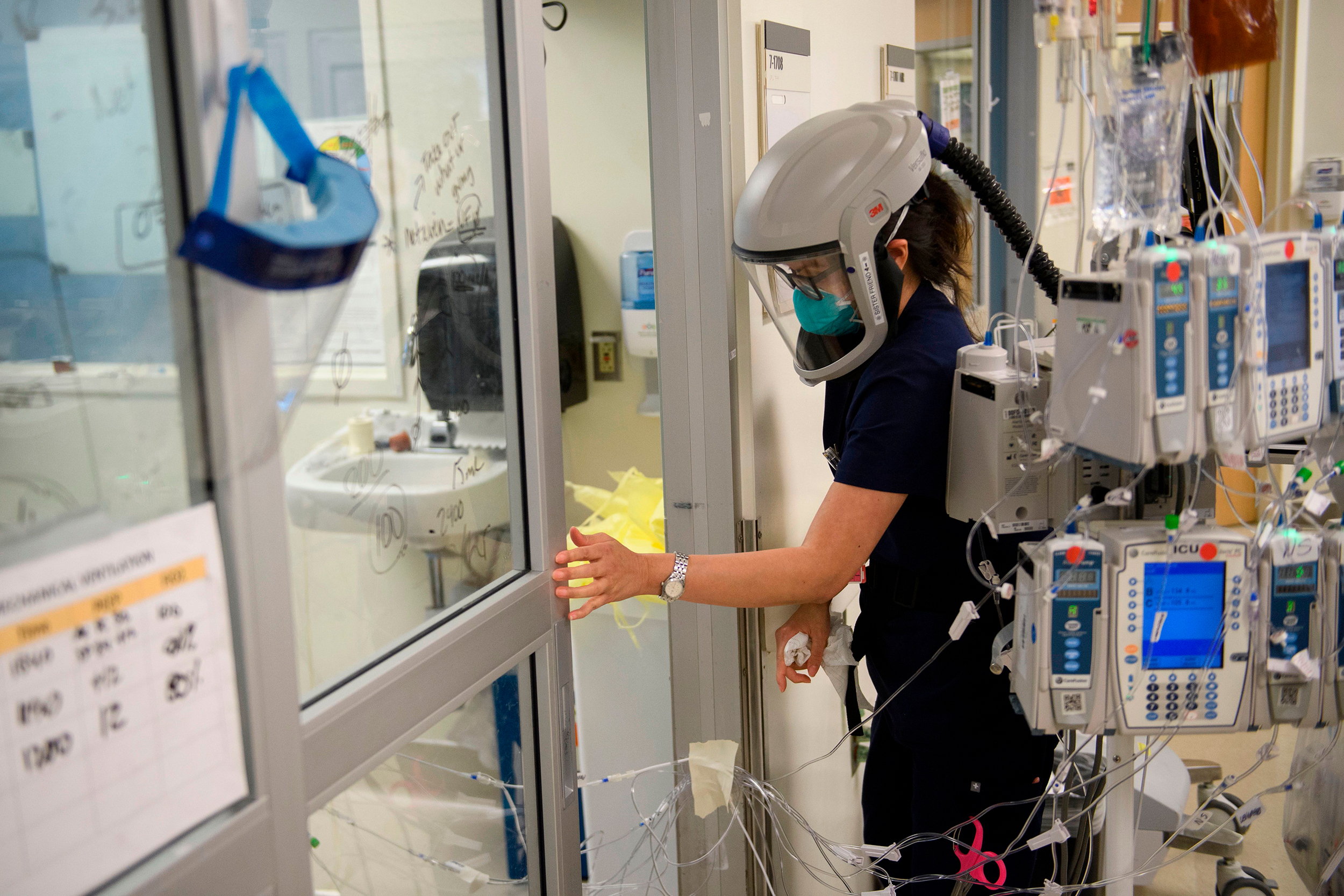 A nurse closes the door to a patient's room in a Covid-19 intensive care unit at Martin Luther King Jr. Community Hospital on January 6 in Los Angeles, California.