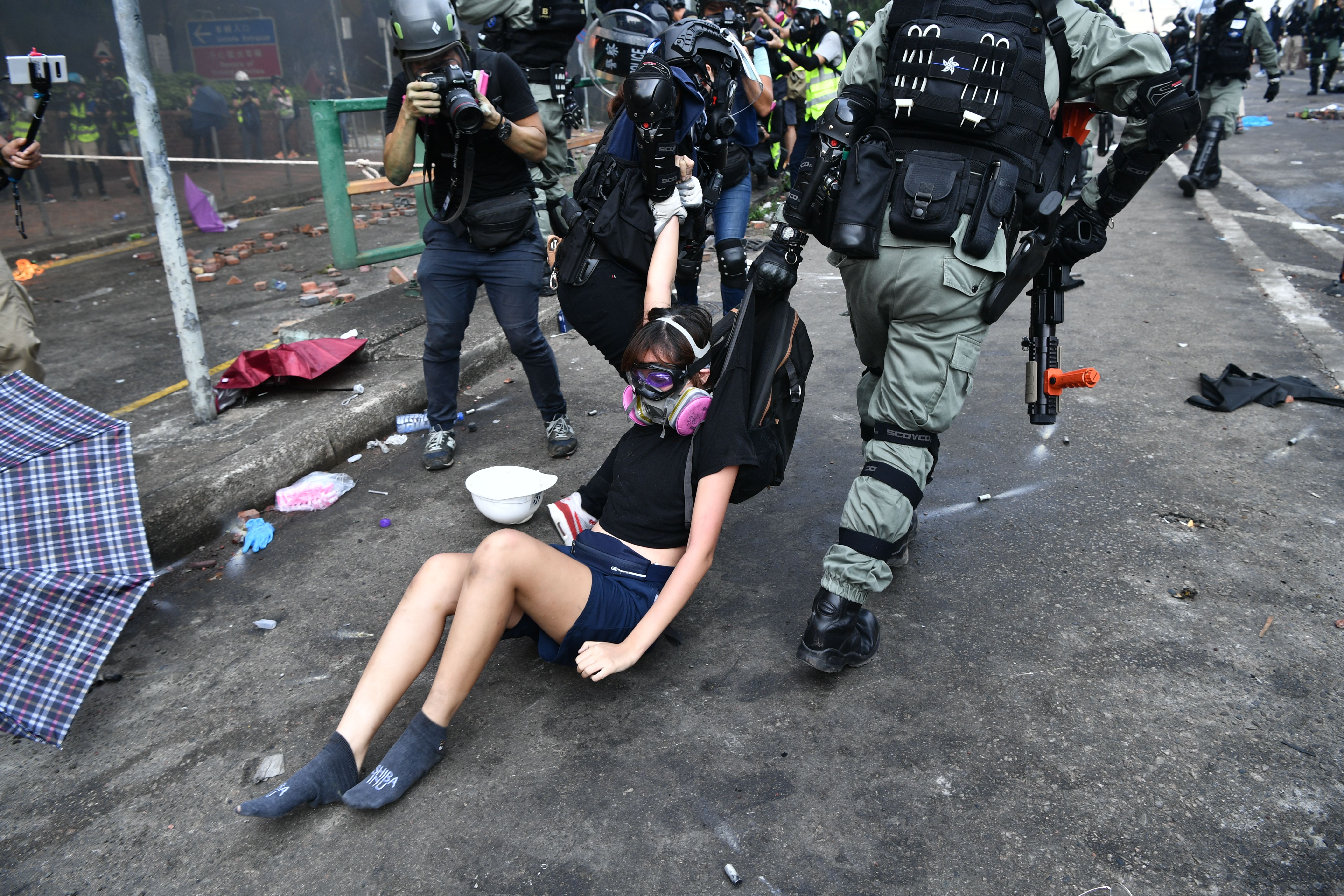 Protesters are detained by police near the Hong Kong Polytechnic University on November 18, 2019.