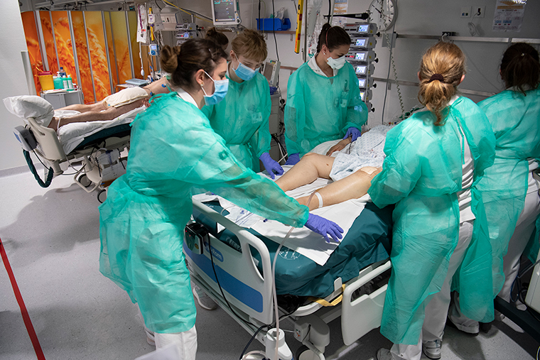 Medical workers treat a patient with COVID-19 in the intensive care unit at the University Hospital in Lausanne, Switzerland, on April 3. 