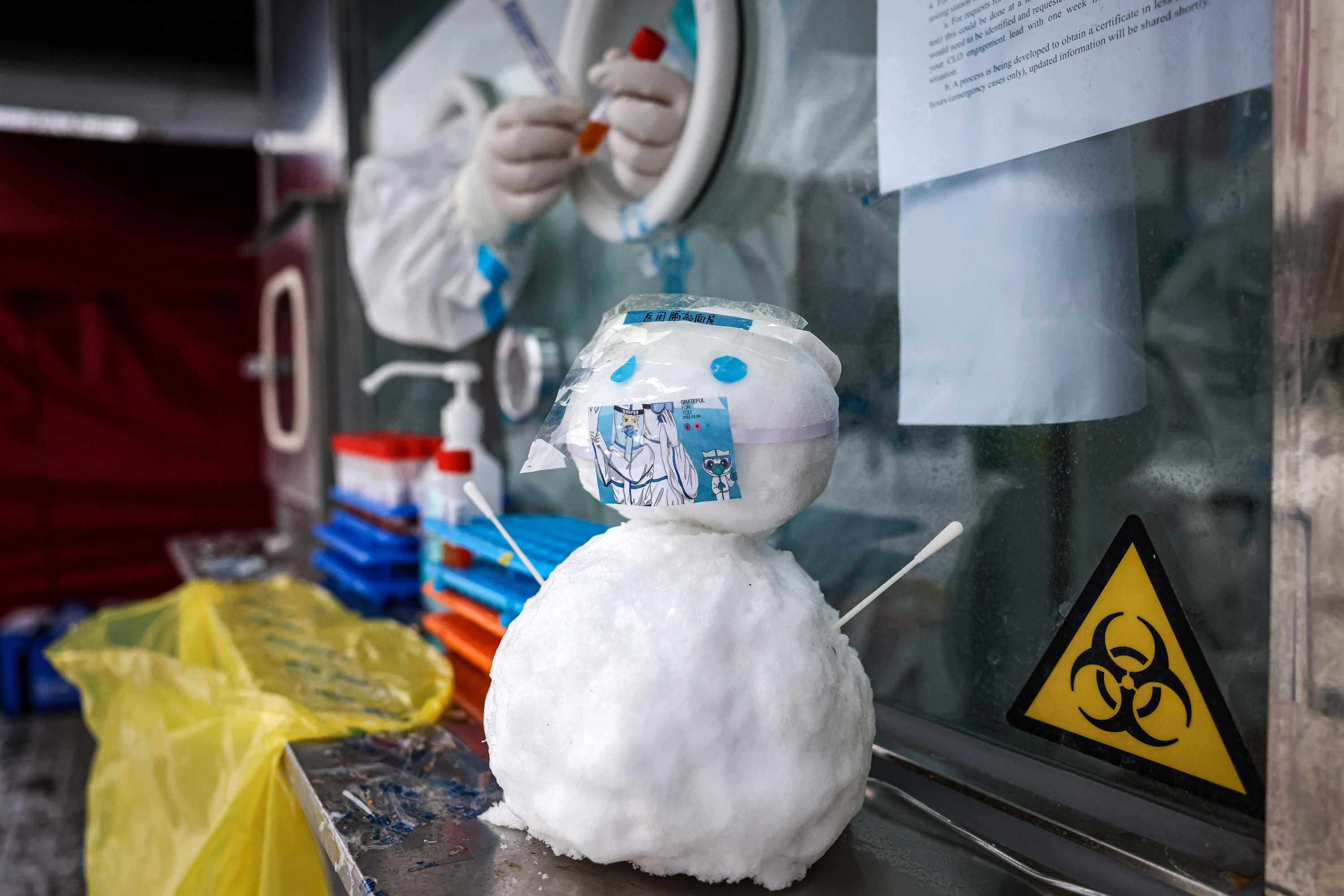 A snowman wearing a "face mask" sits at a Covid-19 testing booth on February 13. 