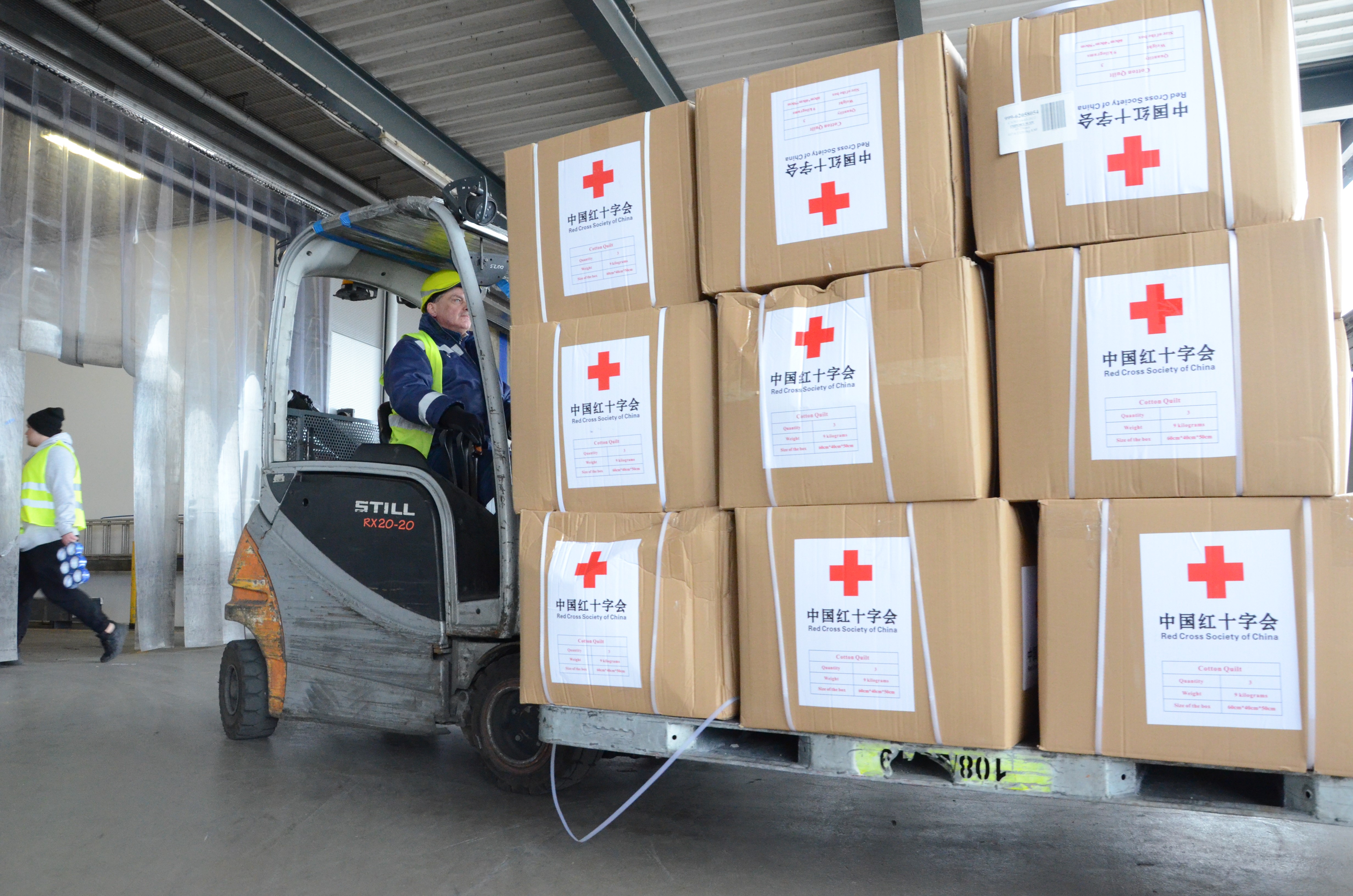 Humanitarian aid supplies sent by the Red Cross Society of China to the Ukrainian Red Cross Society are transported in Warsaw, Poland, on March 15.