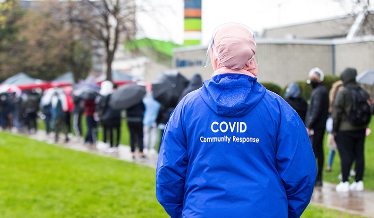 People line up to enter a COVID-19 vaccination clinic in Toronto, Canada, on April 28.