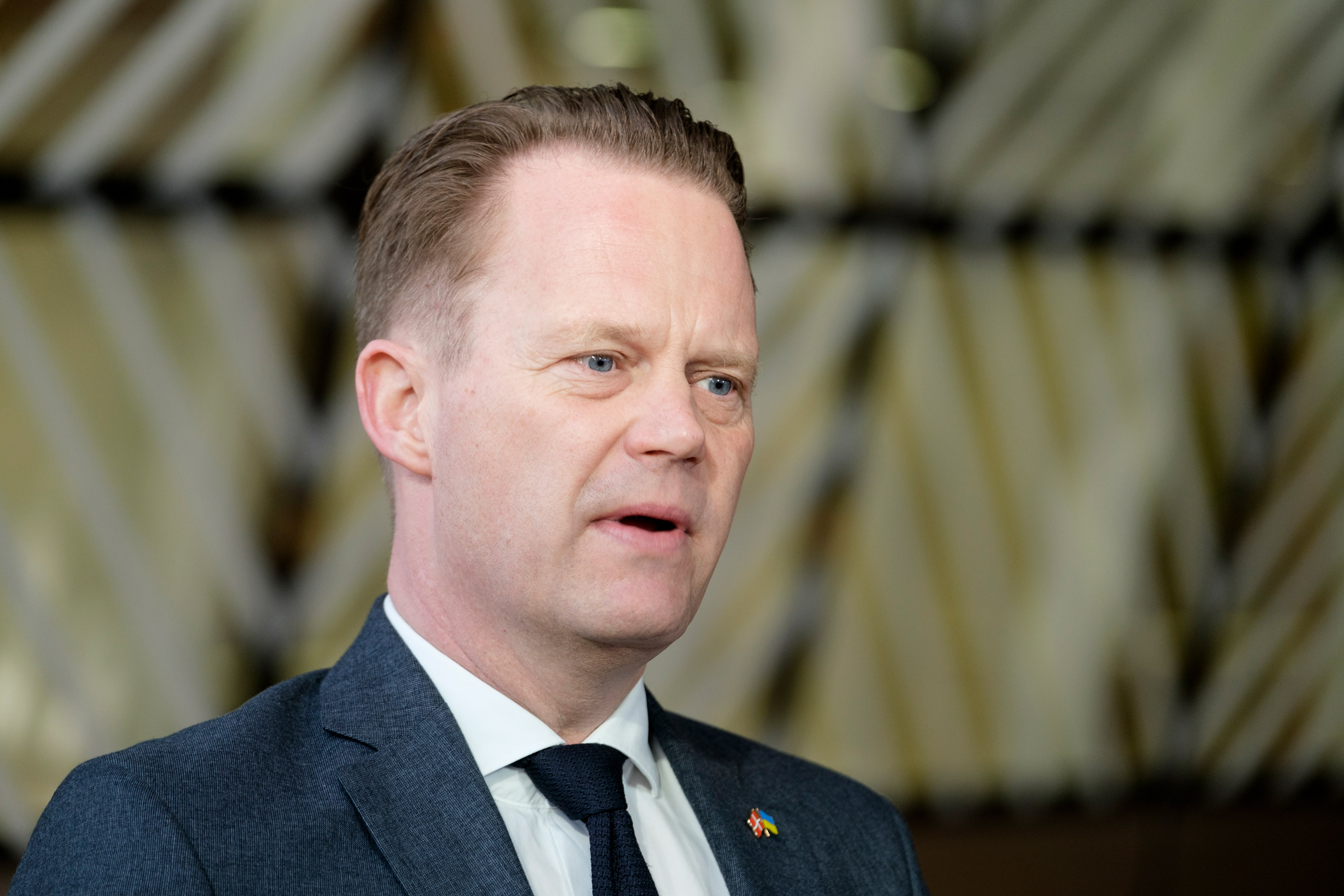 Danish Foreign Minister Jeppe Sebastian Kofod speaks to media in the file photo from March 21, in the EU Council headquarters in Brussels.