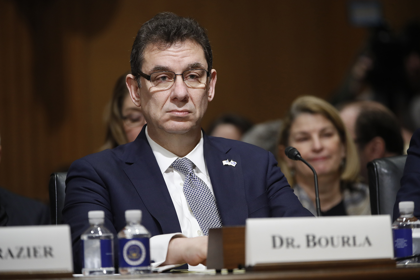 In this Tuesday, Feb. 26, 2019 file photo, Albert Bourla, chief executive officer of Pfizer, prepares to testify before the Senate Finance Committee hearing on drug prices, on Capitol Hill in Washington. 