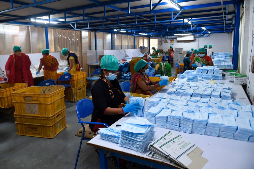 Employees producing facemasks at Salus Products, a manufacturer of surgical disposable products, in Ahmedabad, India, on Thursday.
