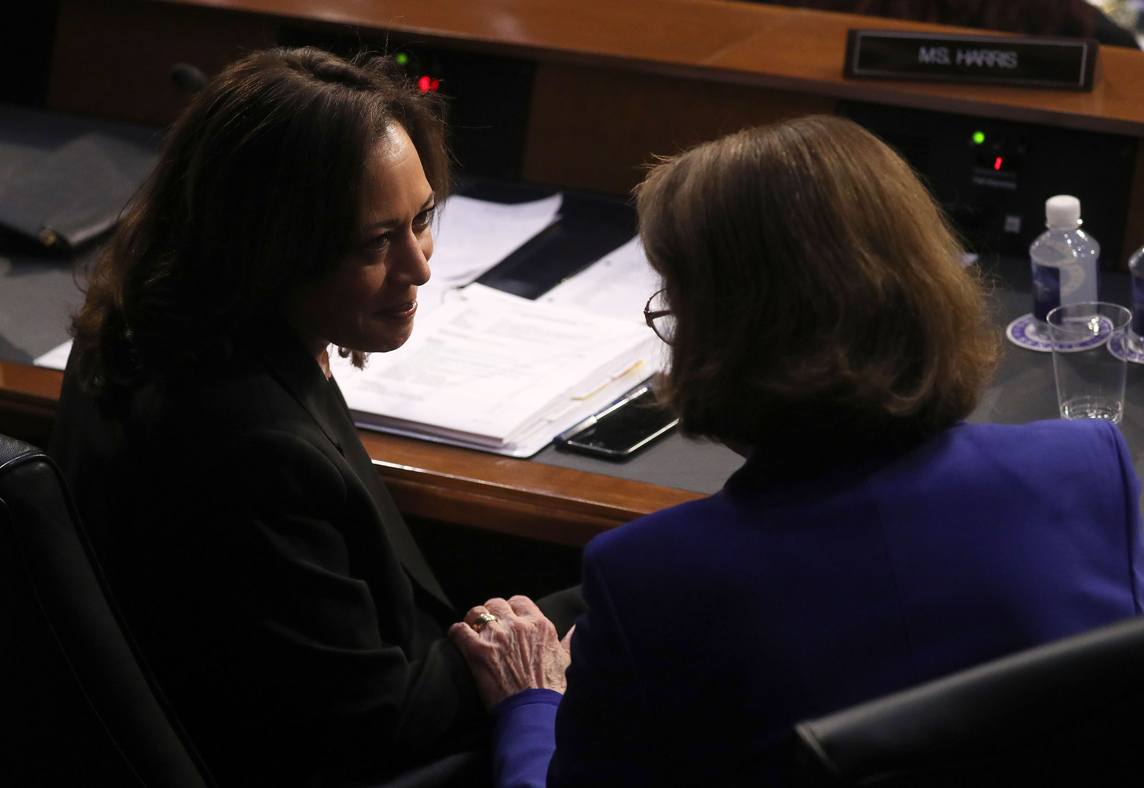 Sen. Kamala Harris speaks with Sen. Dianne Feinstein during a confirmation hearing for William Barr, attorney general nominee for US President Donald Trump, in Washington, DC, on Tuesday, January 15, 2019. 