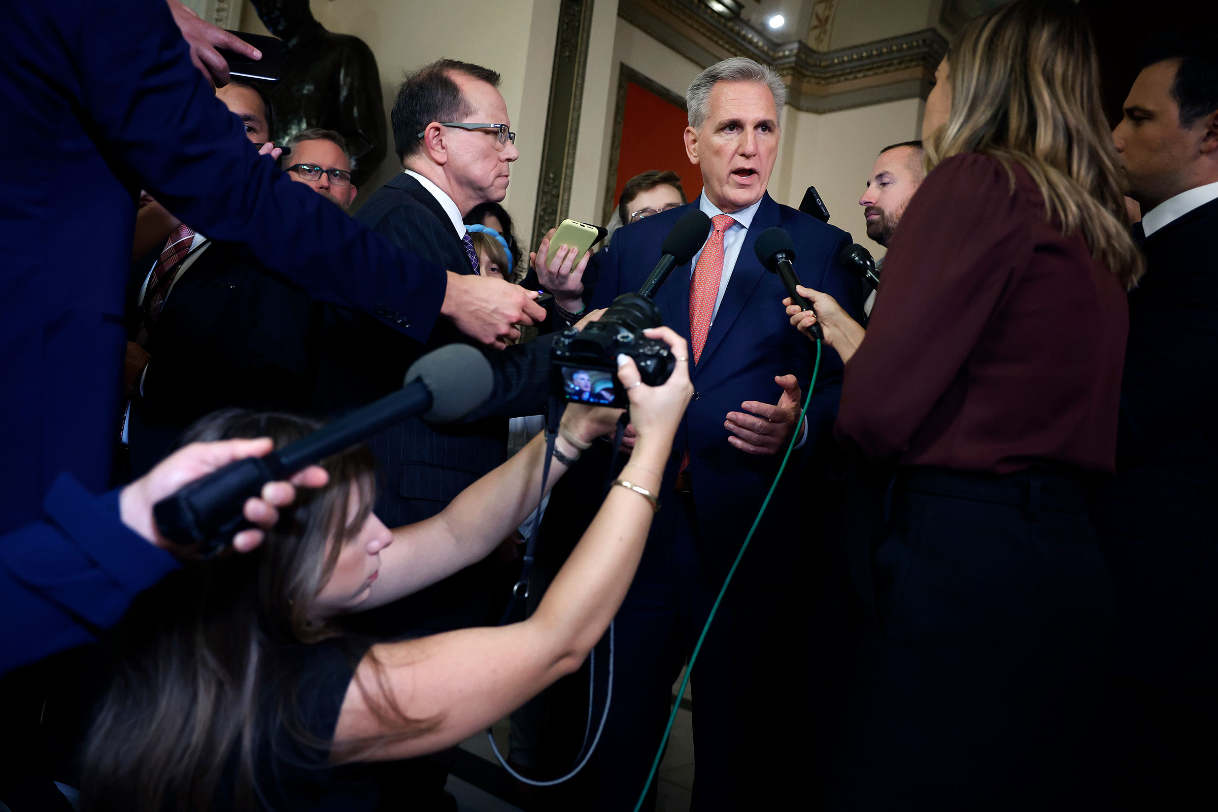 Speaker of the House Kevin McCarthy pauses to talk to reporters as he heads to the House Chamber for a vote at the US Capitol on September 27, 2023 in Washington, DC. 