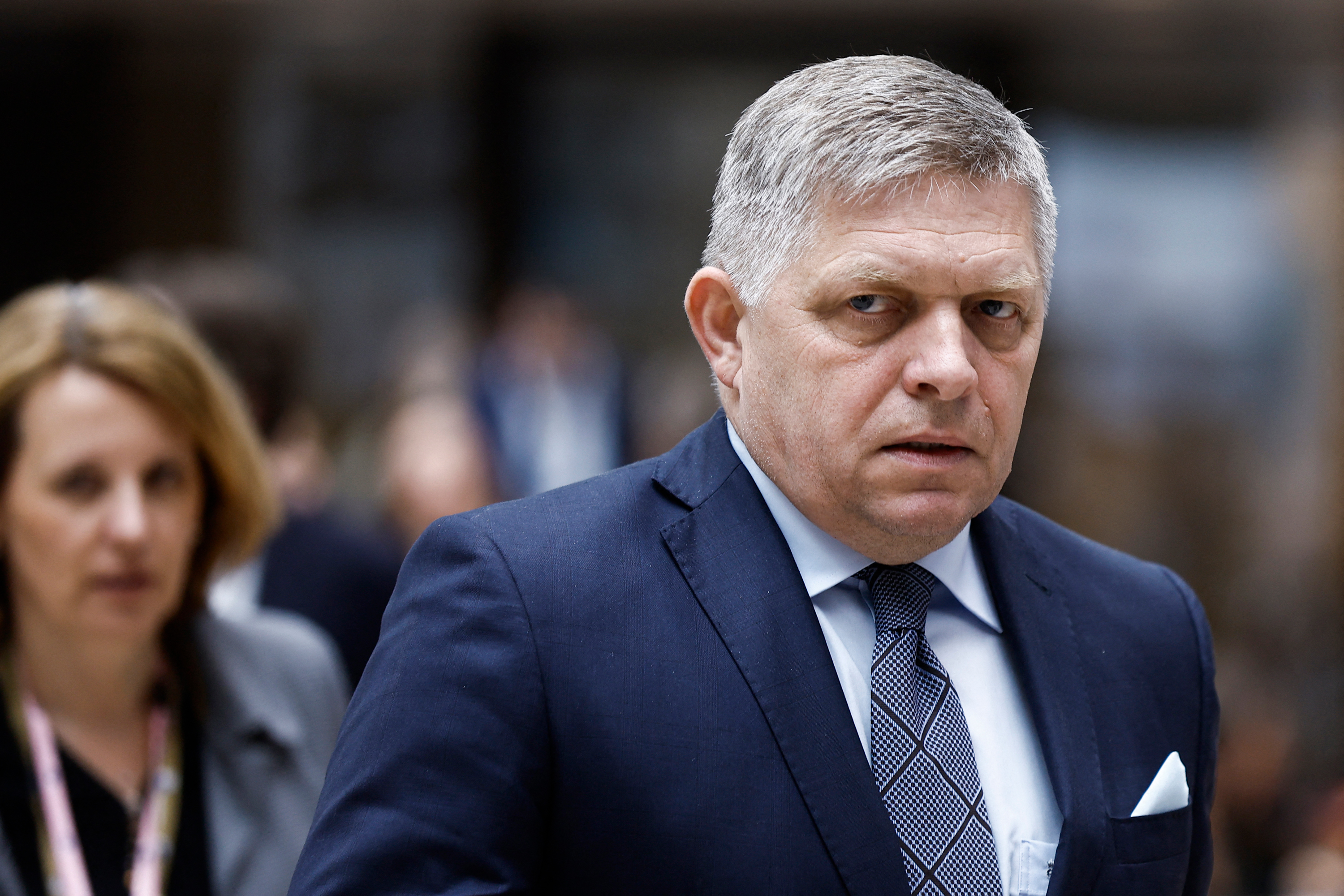 Robert Fico walks during the European Council summit at the EU headquarters in Brussels, on April 18.