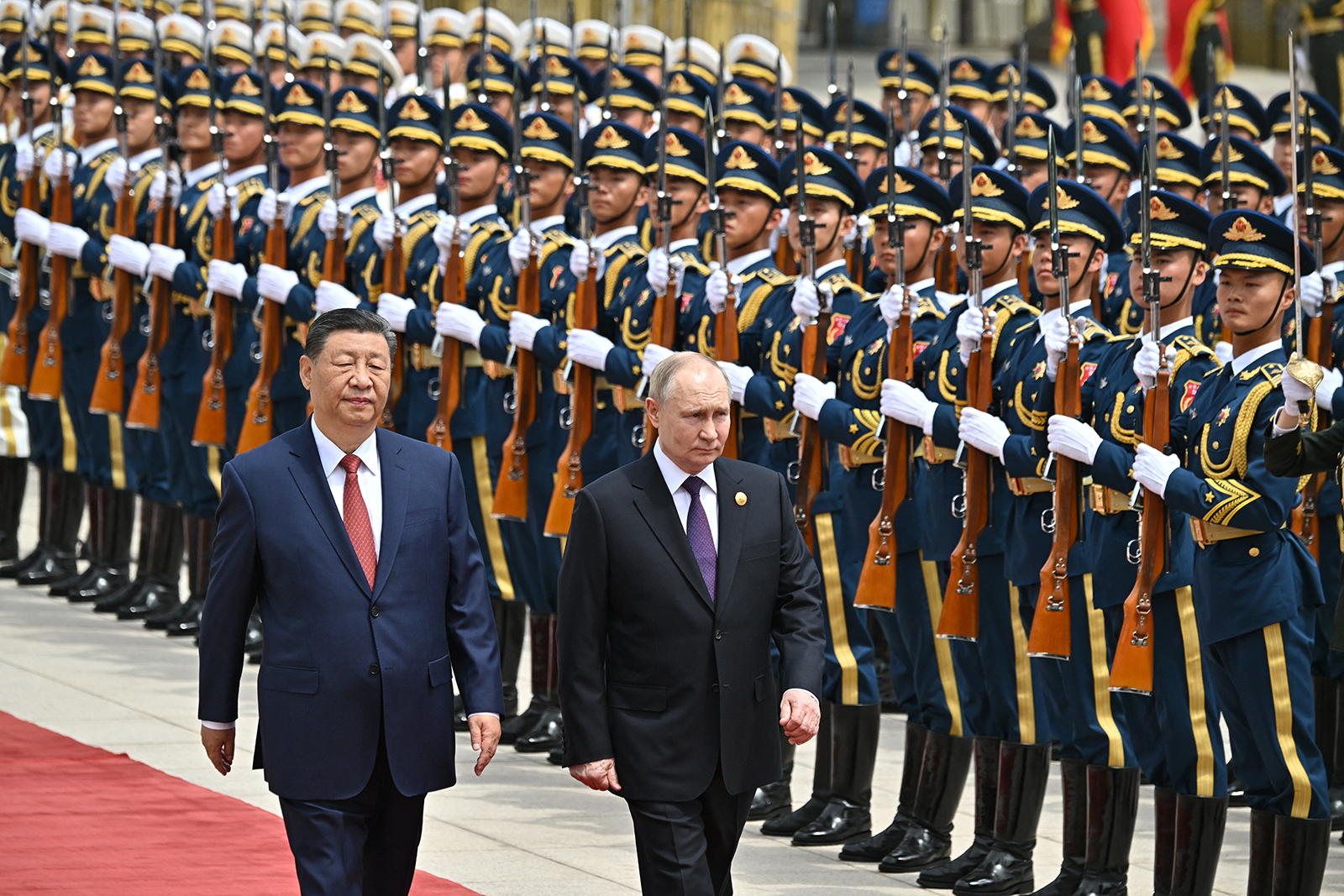 Russia's President Vladimir Putin and China's President Xi Jinping attend an official welcoming ceremony in front of the Great Hall of the People in Tiananmen Square in Beijing on May 16.