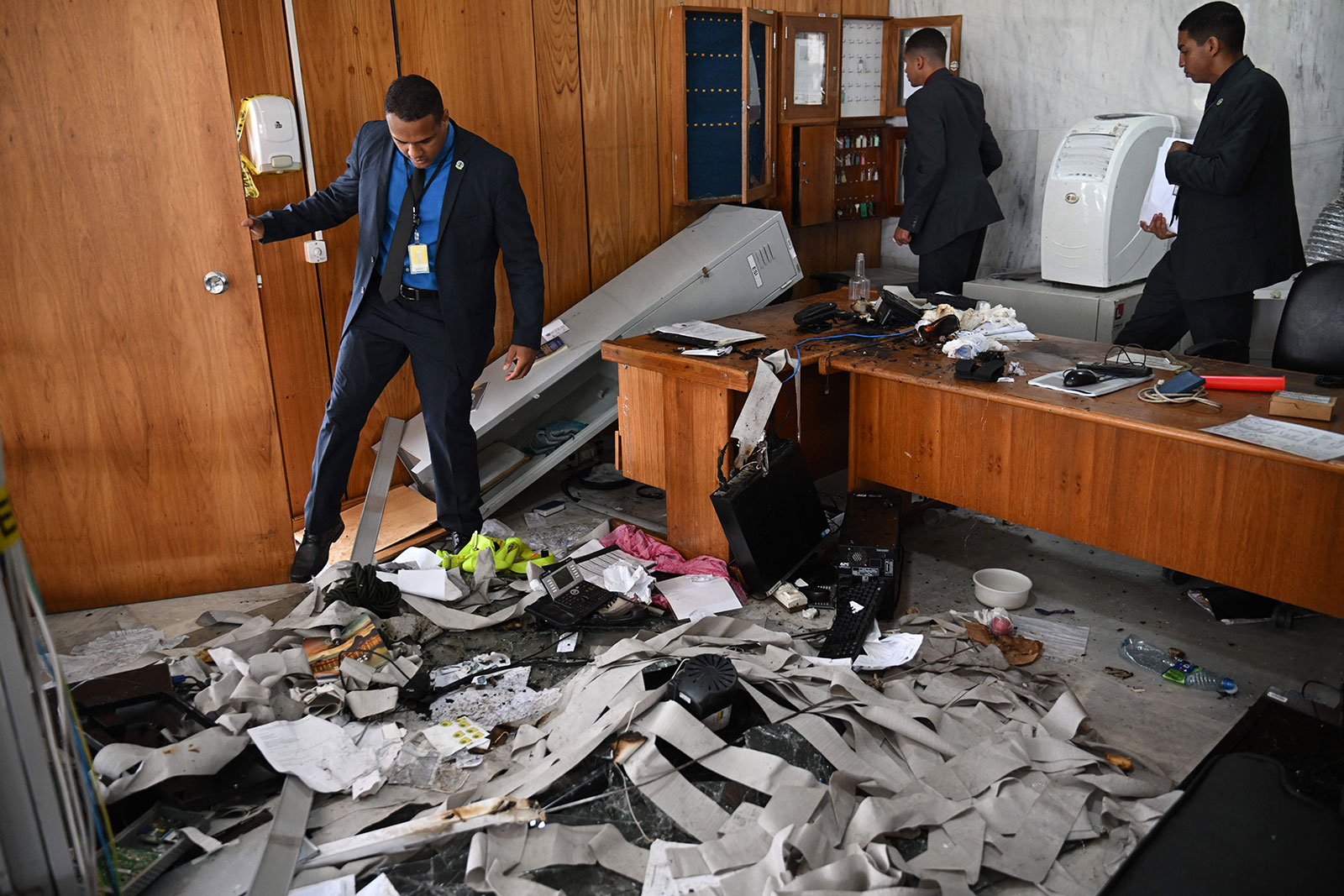 Planalto Presidential Palace security members inspect offices destroyed the day after supporters of former Brazilian President Jair Bolsonaro stormed the building. 
