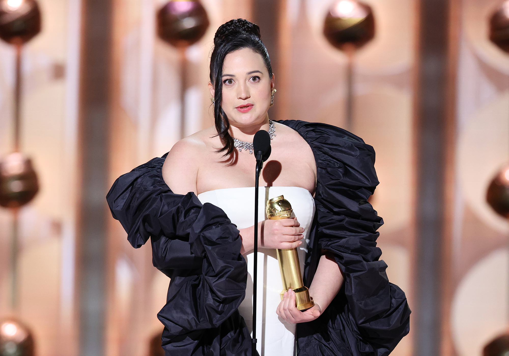 Lily Gladstone accepts her Golden Globe award.
